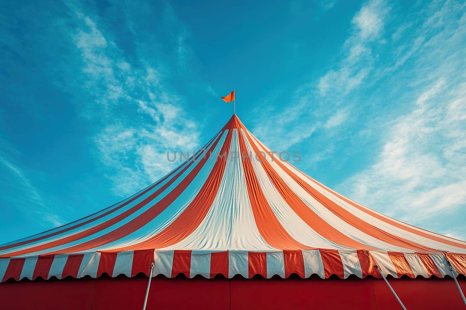 Circus tent roof against blue sky, horizontal banner for world circus day