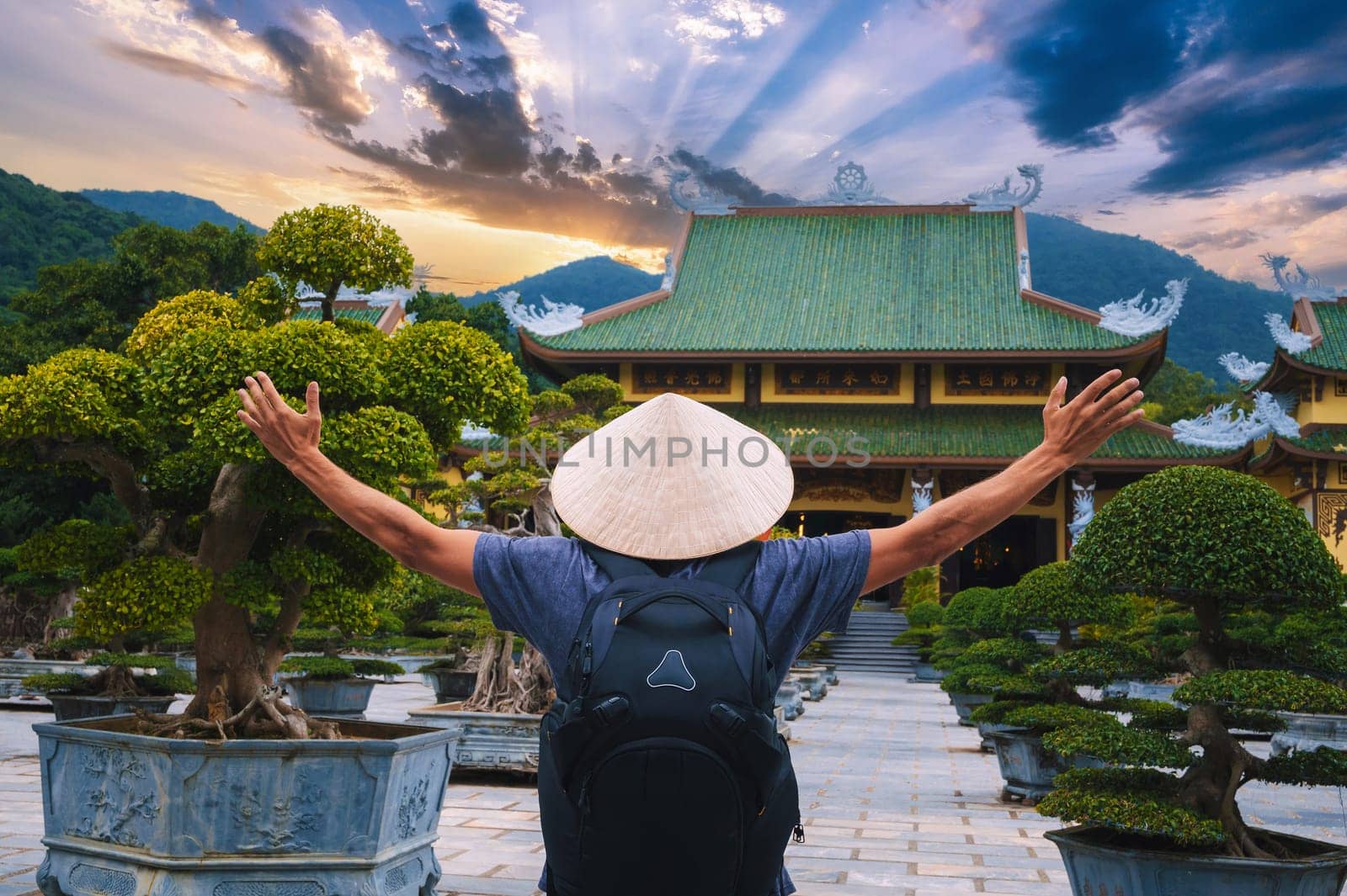 male tourist traveler at Buddhist temple at the Linh Ung Pagoda in Da Nang in Vietnam. Concept of travel and tourism in Asia