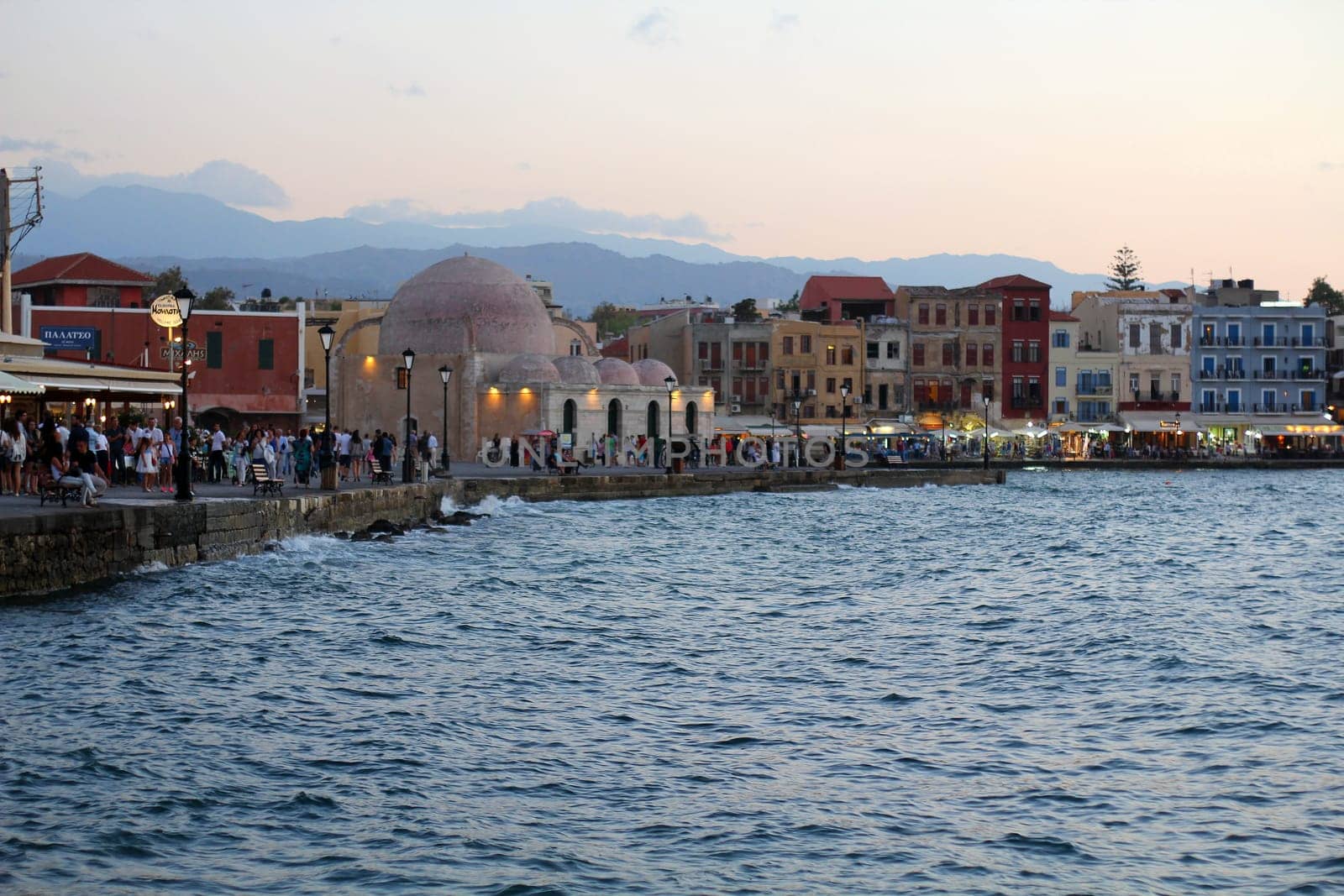 Picturesque old port of Chania. Landmarks of Crete island. Greece. Bay of Chania at sunny summer day, Crete Greece. View of the old port of Chania, Crete, Greece. The port of chania, or Hania.