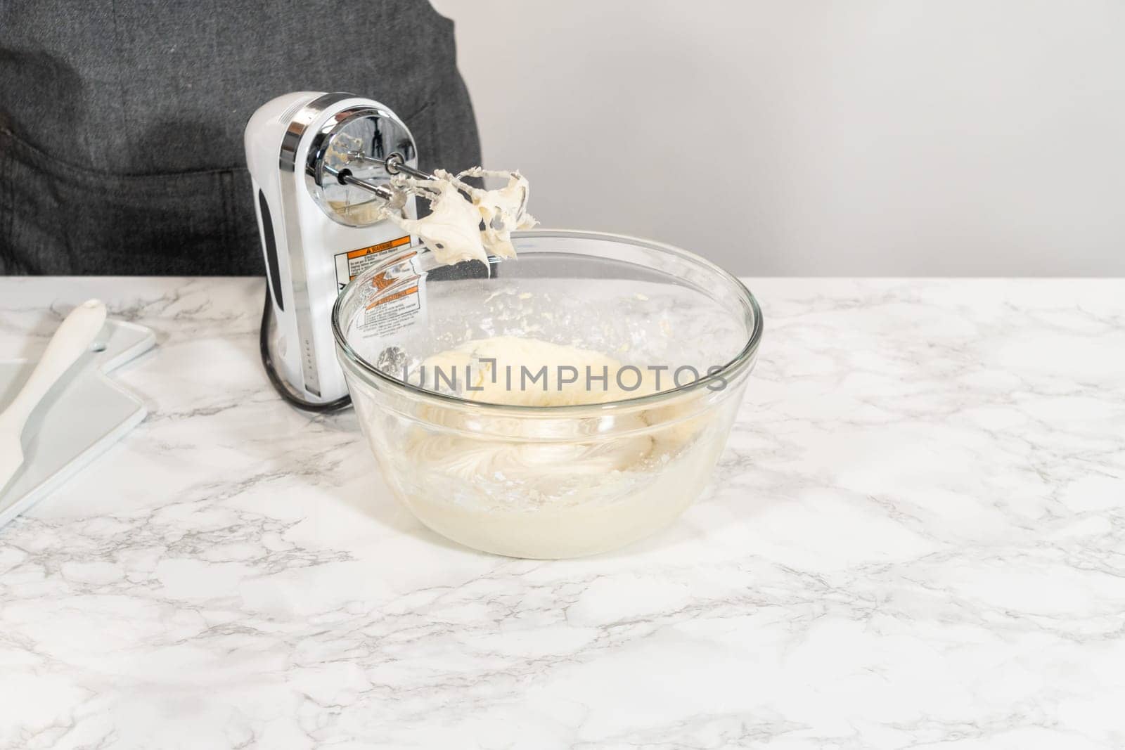 Creating a delectable treat, the process of making homemade cream cheese frosting involves whisking together creamy ingredients to achieve the perfect texture and taste.