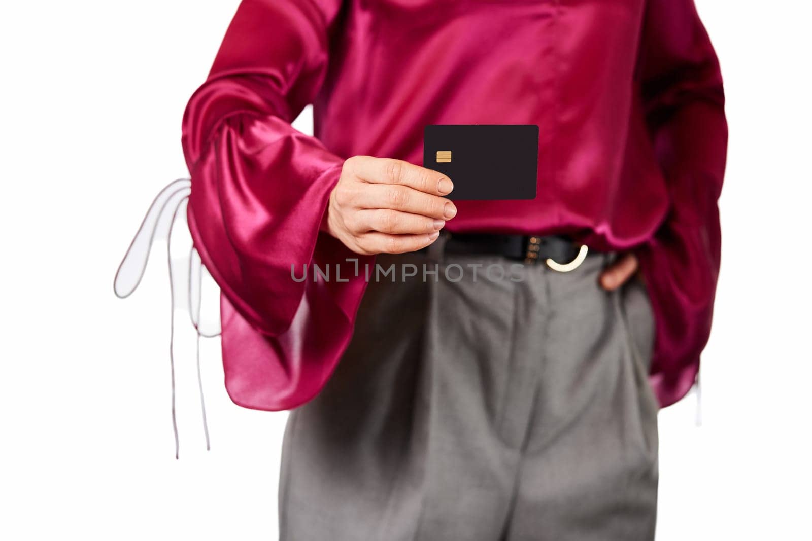 female hand holding black premium credit bank card on white background. payment online