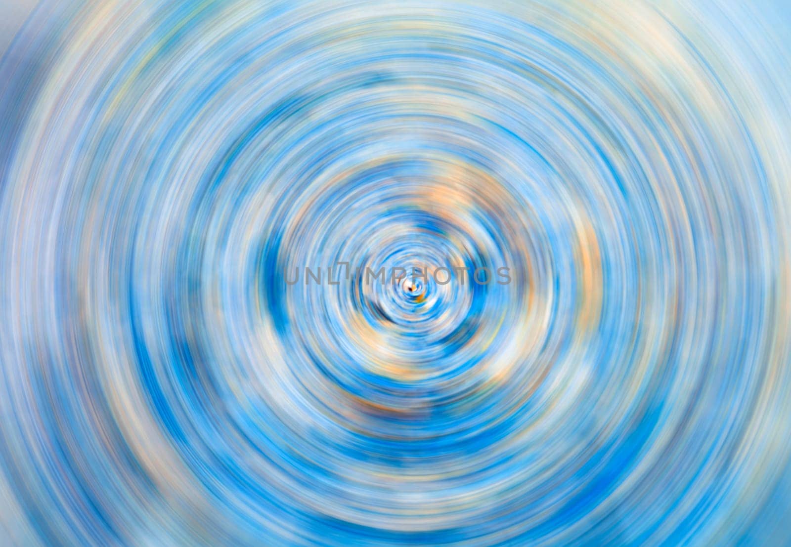Frosty circular motion blur, abstract background in blue and yellow tones
