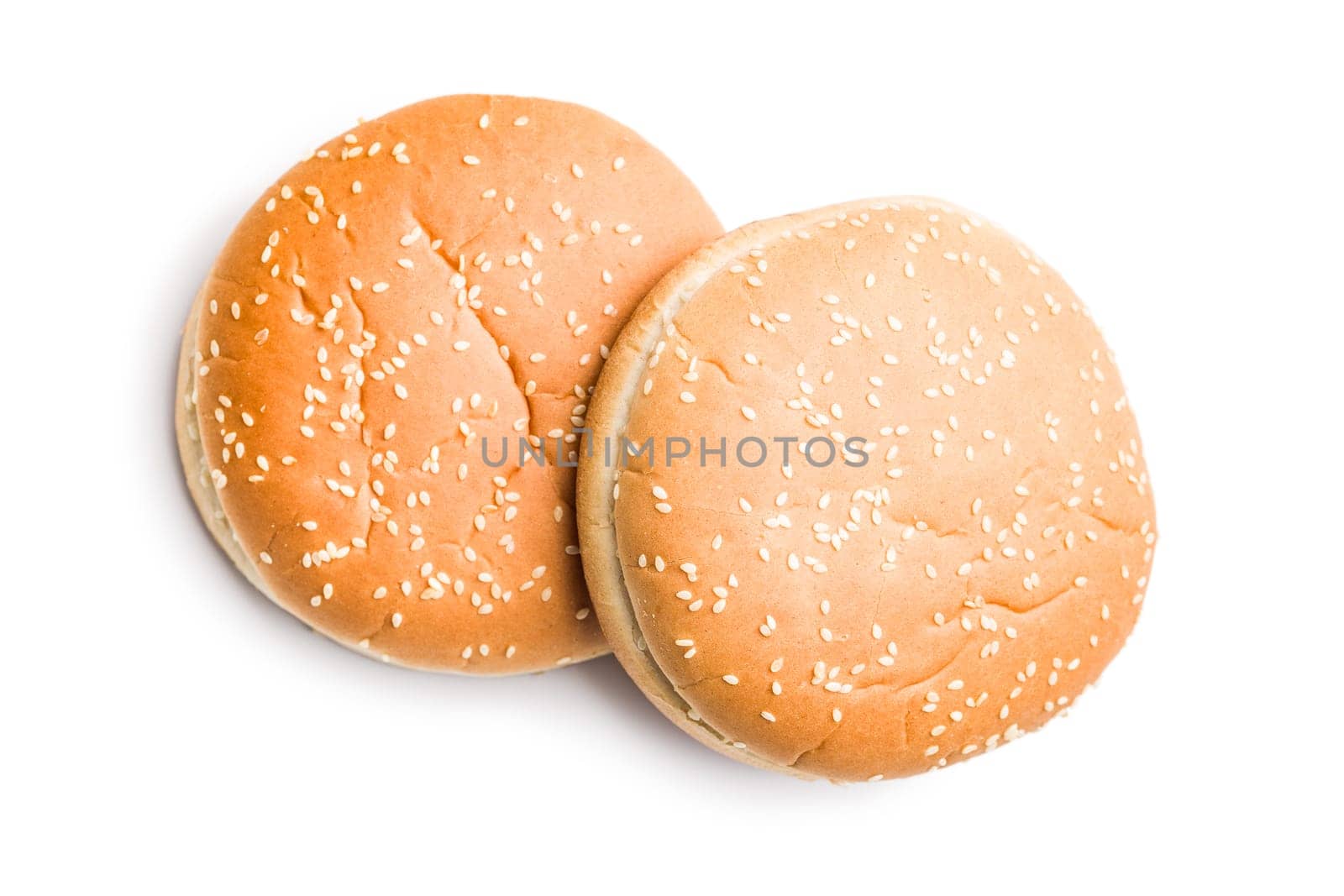 Empty burger bun with sesame seeds isolated on a white background.