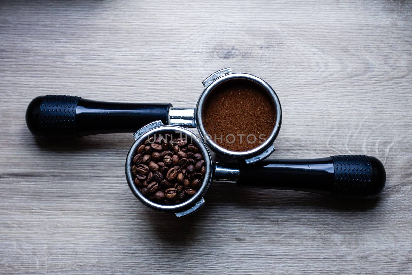a cup of coffee a coffee horn with natural ground coffee and temper on a white background close-up, selective focus