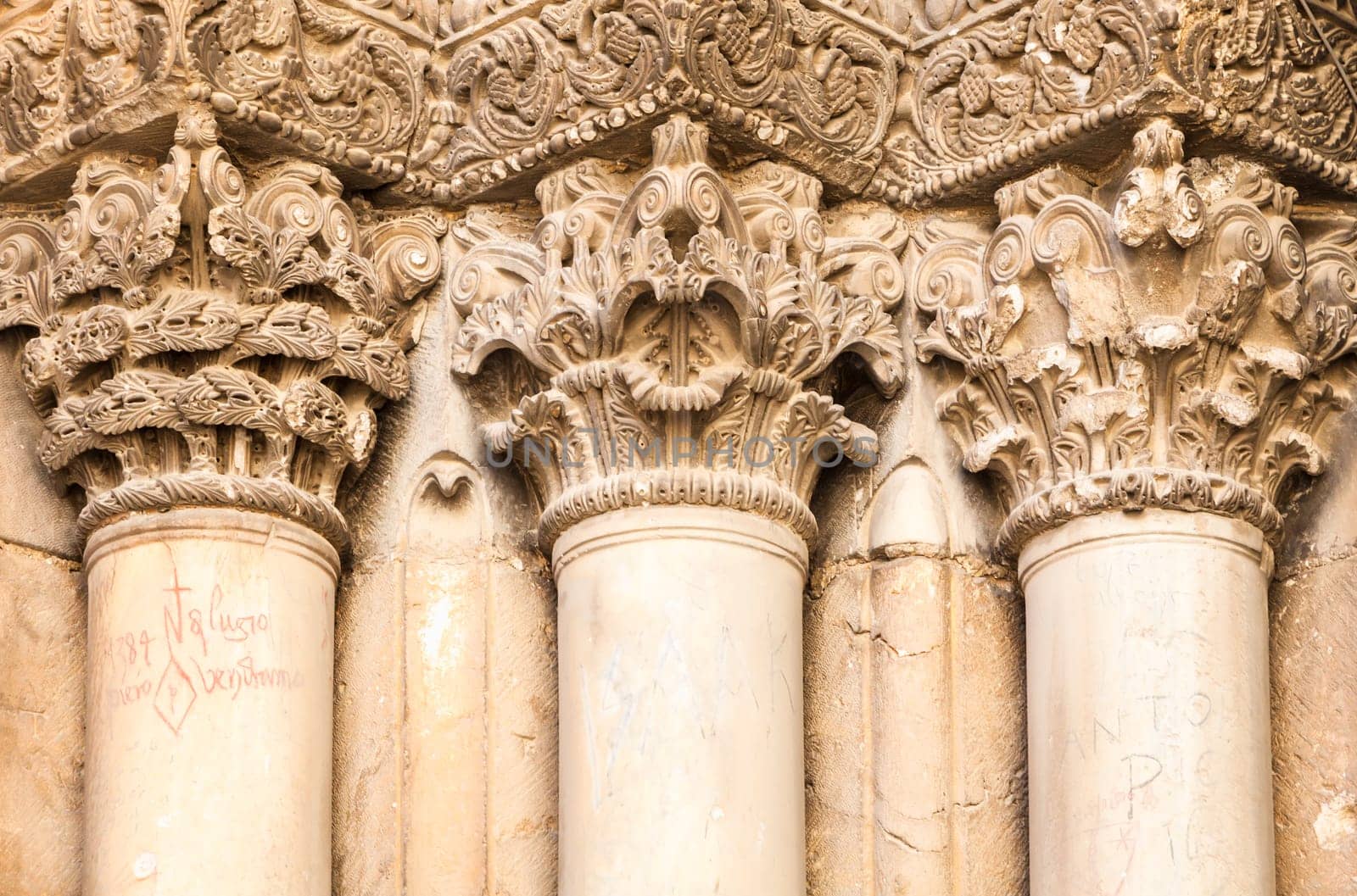 This image features a detailed closeup view of a row of beautiful columns on an impressive architectural building structure