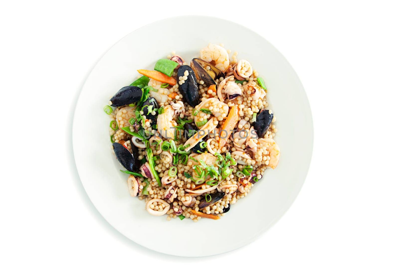 A vibrant seafood salad featuring quinoa, fresh vegetables, and assorted seafood, perfect for healthy meals