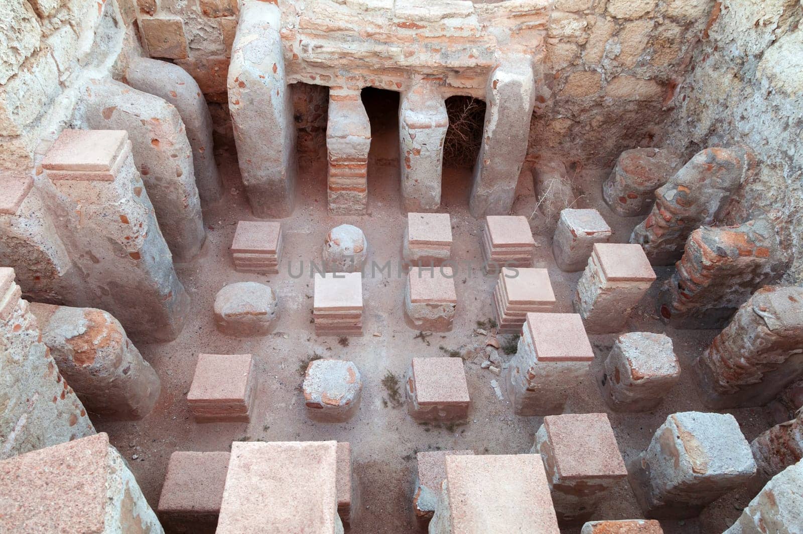 An ancient archaeological site featuring impressive stone structures that showcase the ingenuity of early civilization