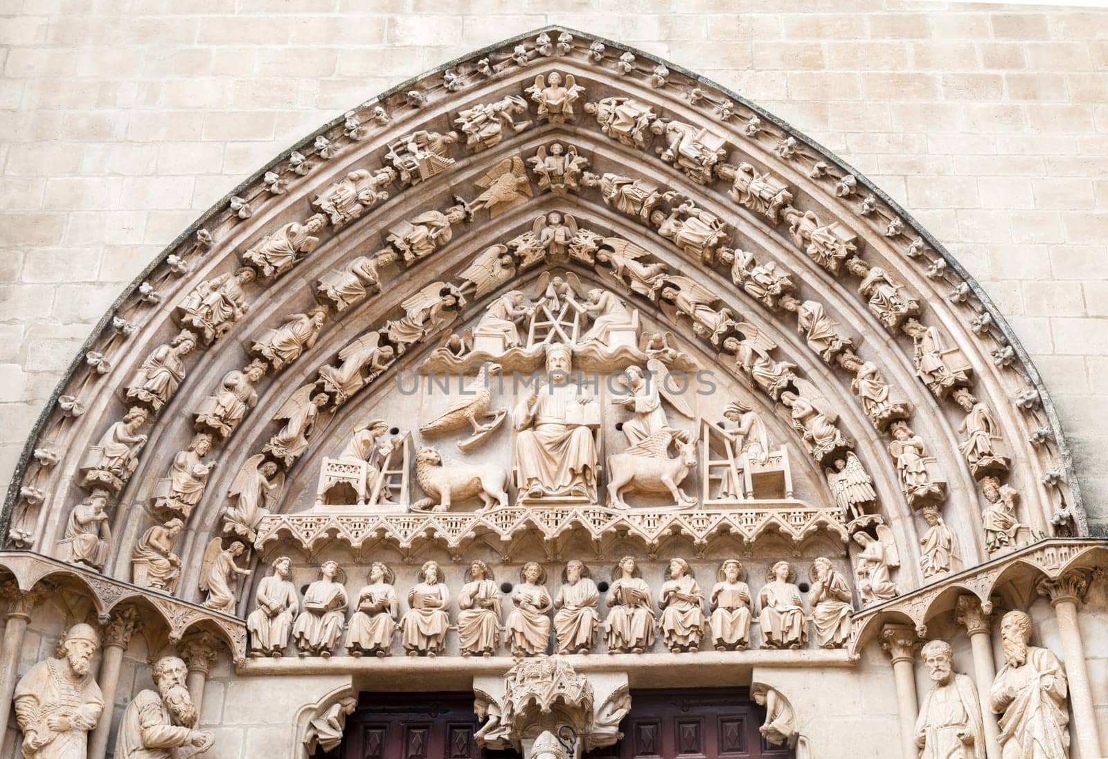 Detailed stone facade of the Cathedral in Burgos, Spain, with its gothic artwork.