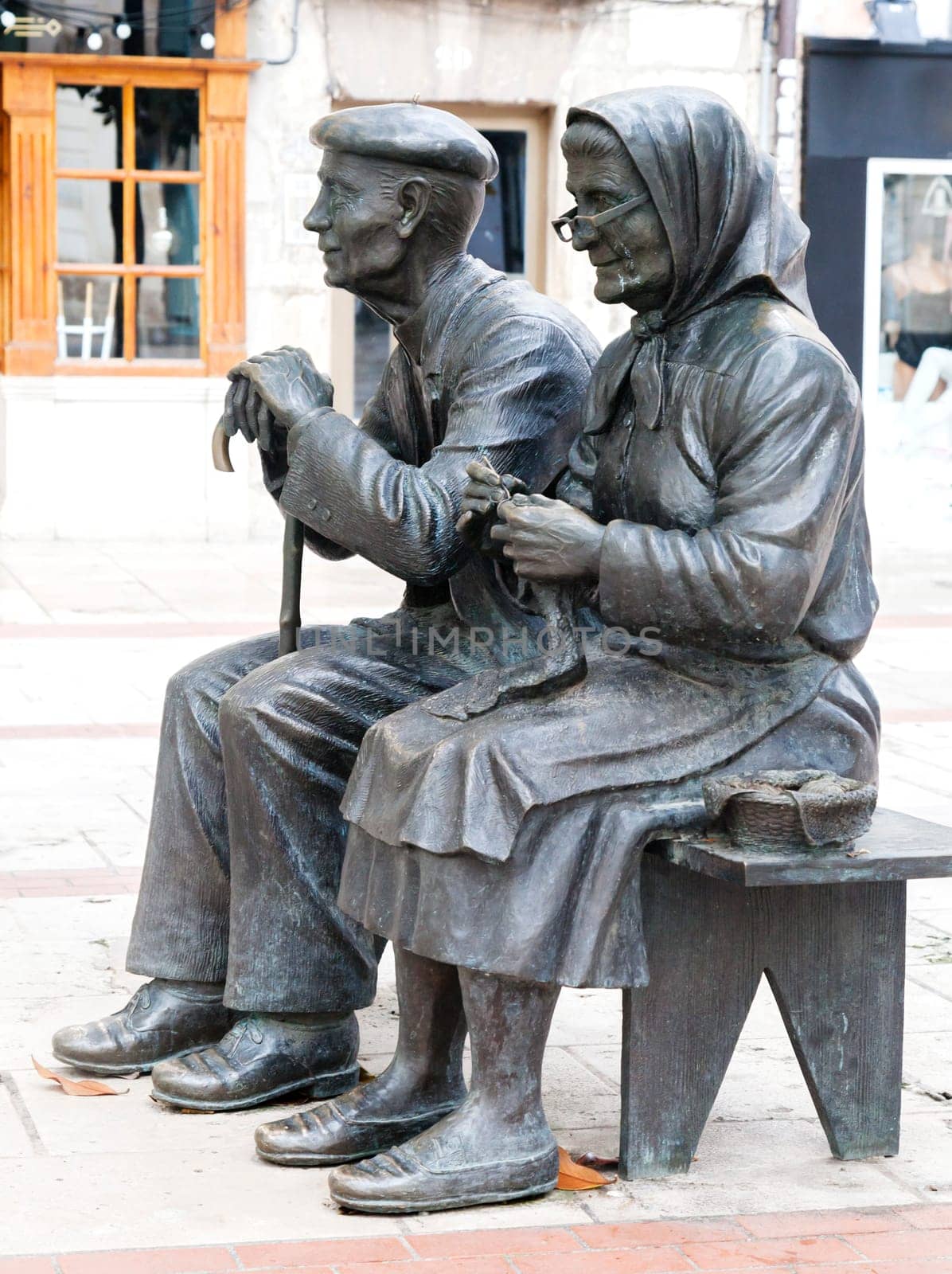 BURGOS, SPAIN - May 29, 2016 - These bronze statues depict an elderly couple sitting on a bench