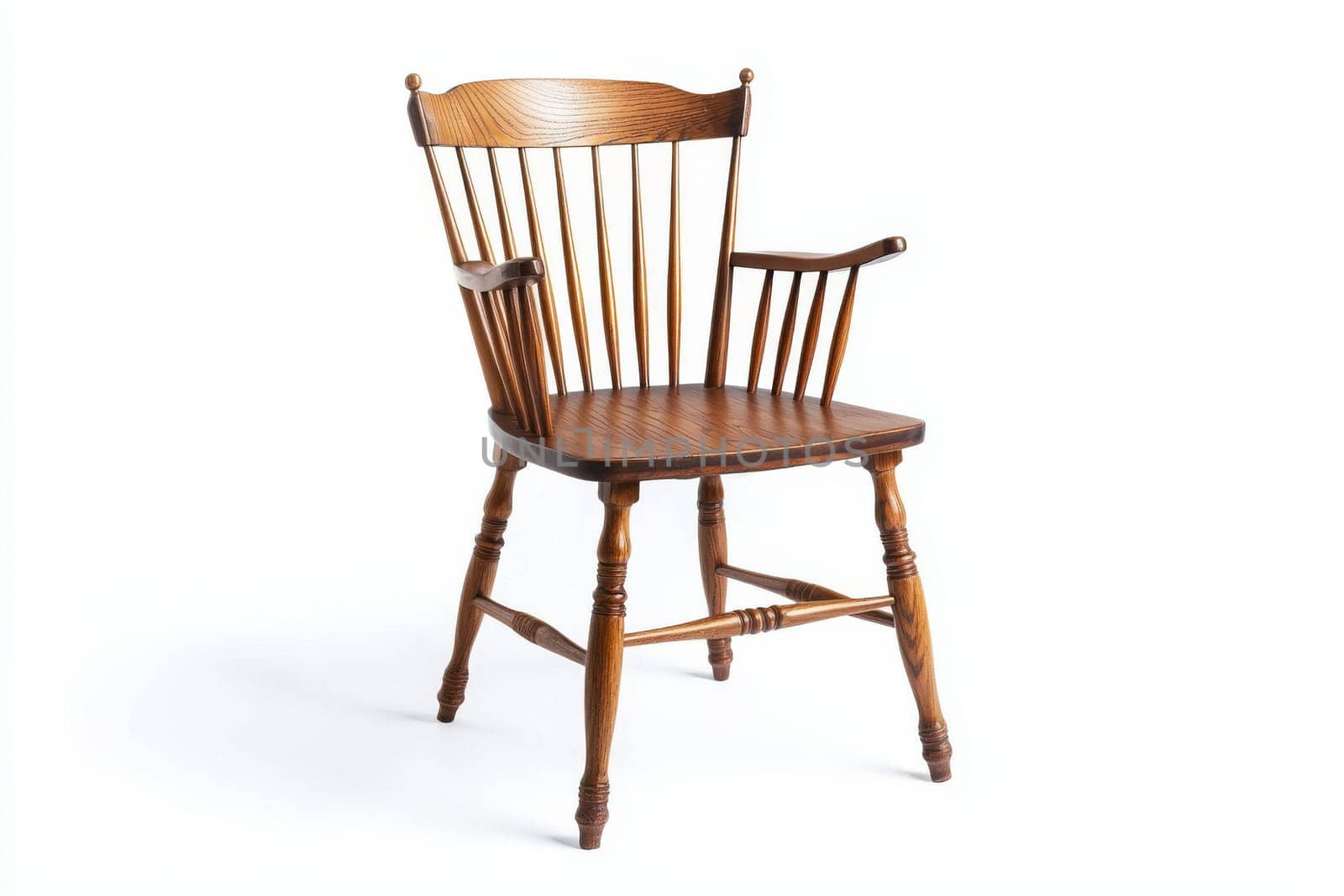 A beautifully crafted wooden chair features a classic design with spindles and armrests, perfect for interior decor.