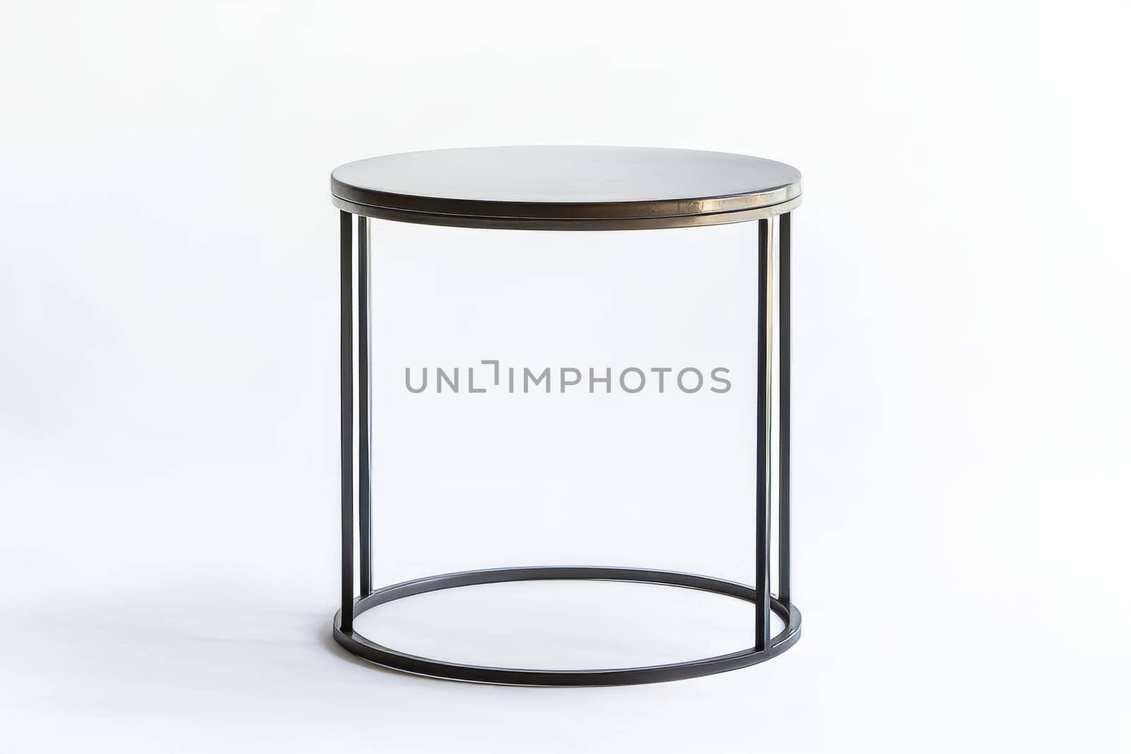 This round table features a sleek design with a black top and minimalistic metal legs, ideal for contemporary living spaces.