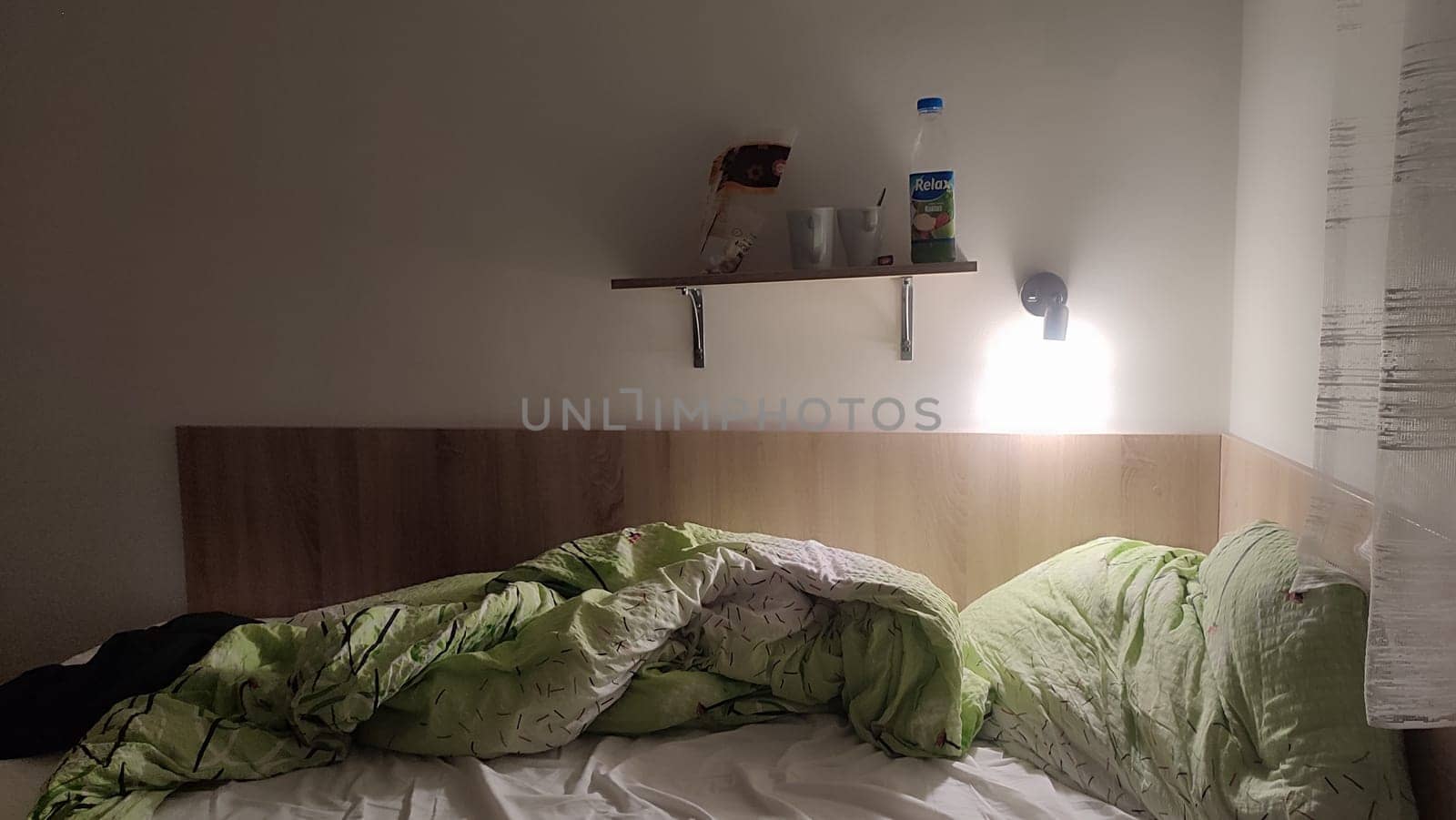 October 16 2024 Decin Czech Republic Europe travel places. Disorganized bed shelf room apartment hotel interior design decor furniture . High quality photo