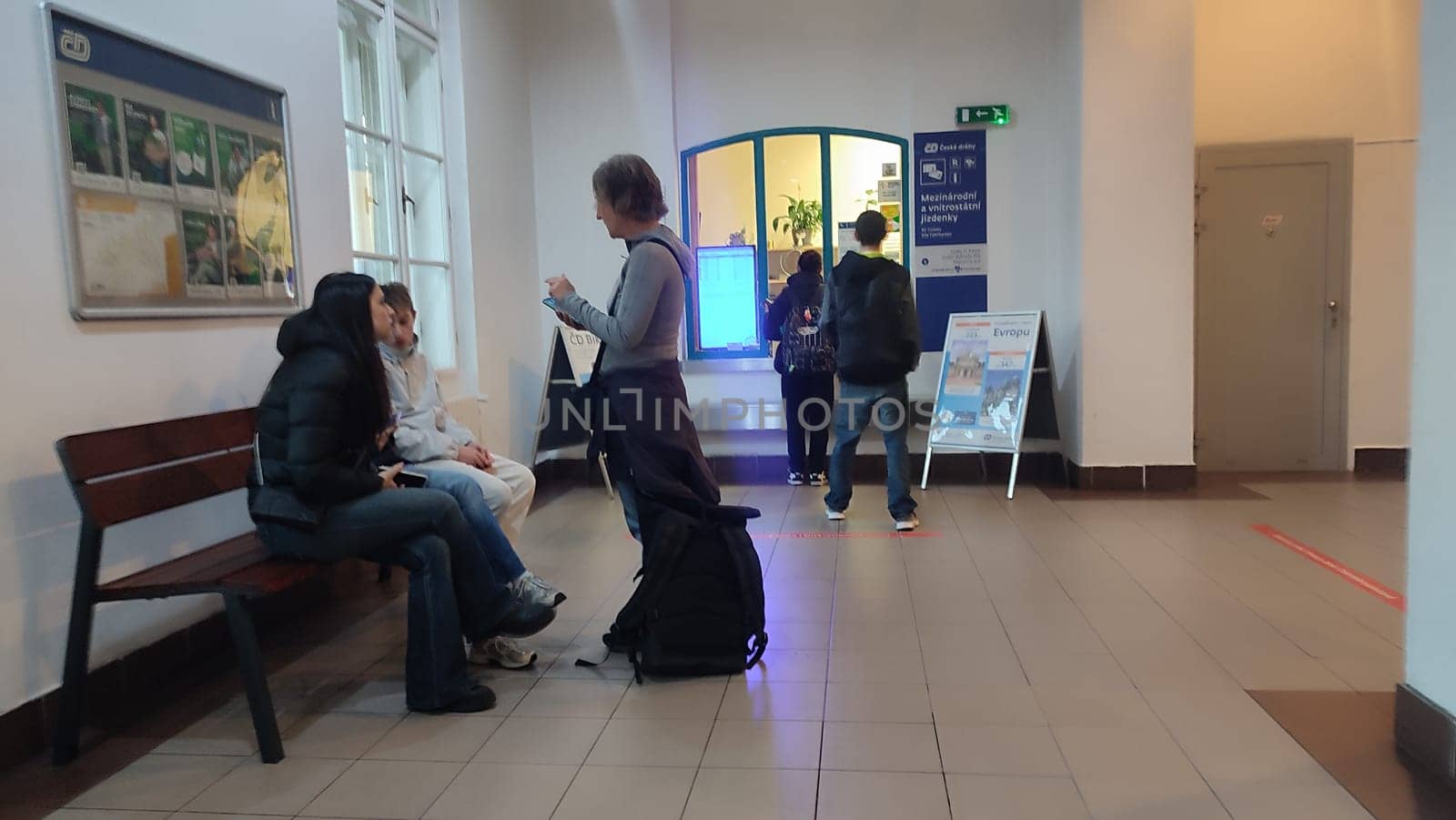 October 16 2024 Decin Czech Republic Europe. Travel transport station train bus hallway conversation. Indoor people womens . High quality photo
