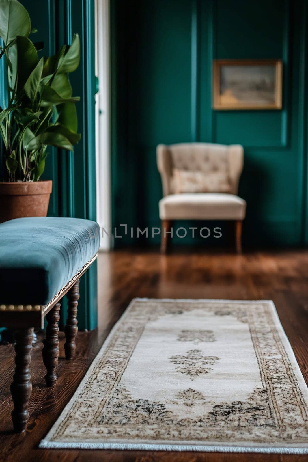 A cozy hallway featuring a vintage rug and a plush armchair against teal walls, creating a warm and inviting atmosphere.