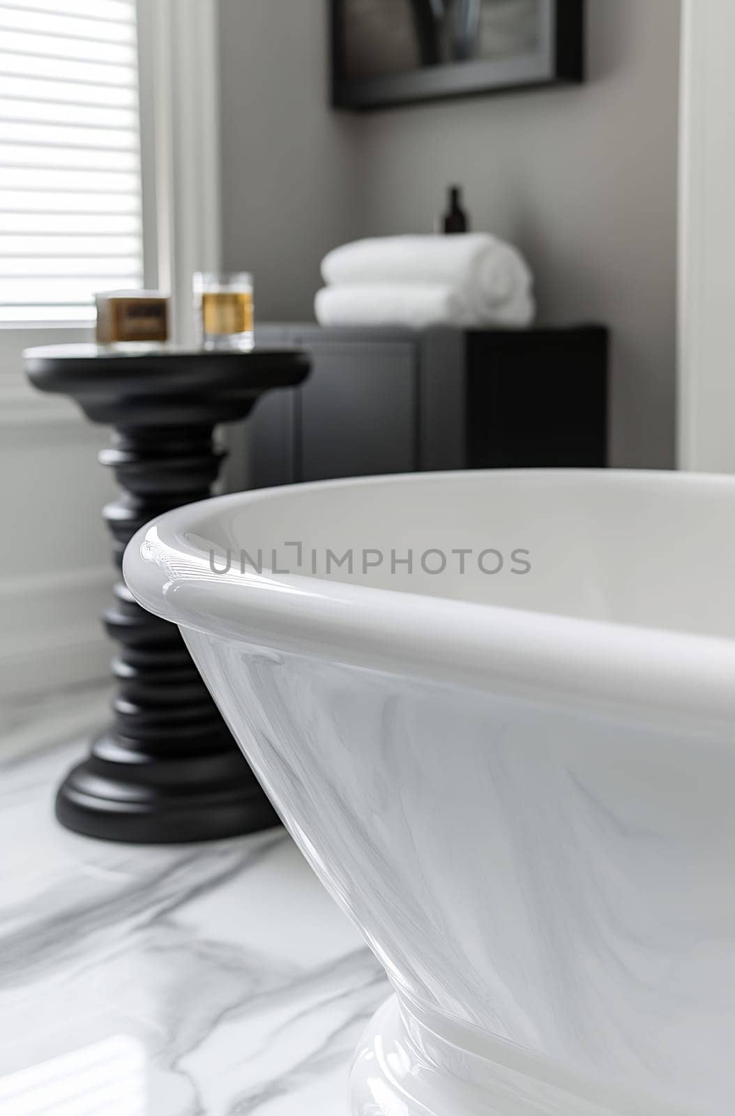 A spacious bathroom features a freestanding tub, stylish decor, and smooth marble flooring, creating a relaxing atmosphere for relaxation.