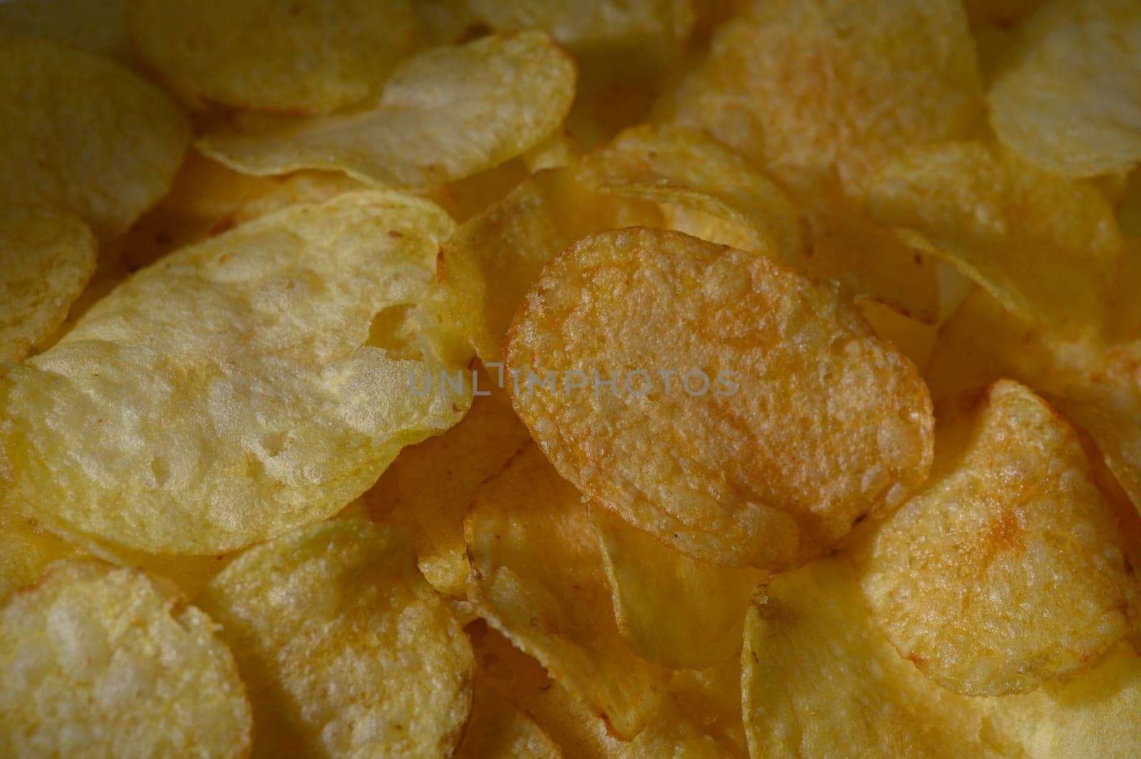 Crispy potato chips spread out in a colorful display, inviting a delightful snacking experience for all.
