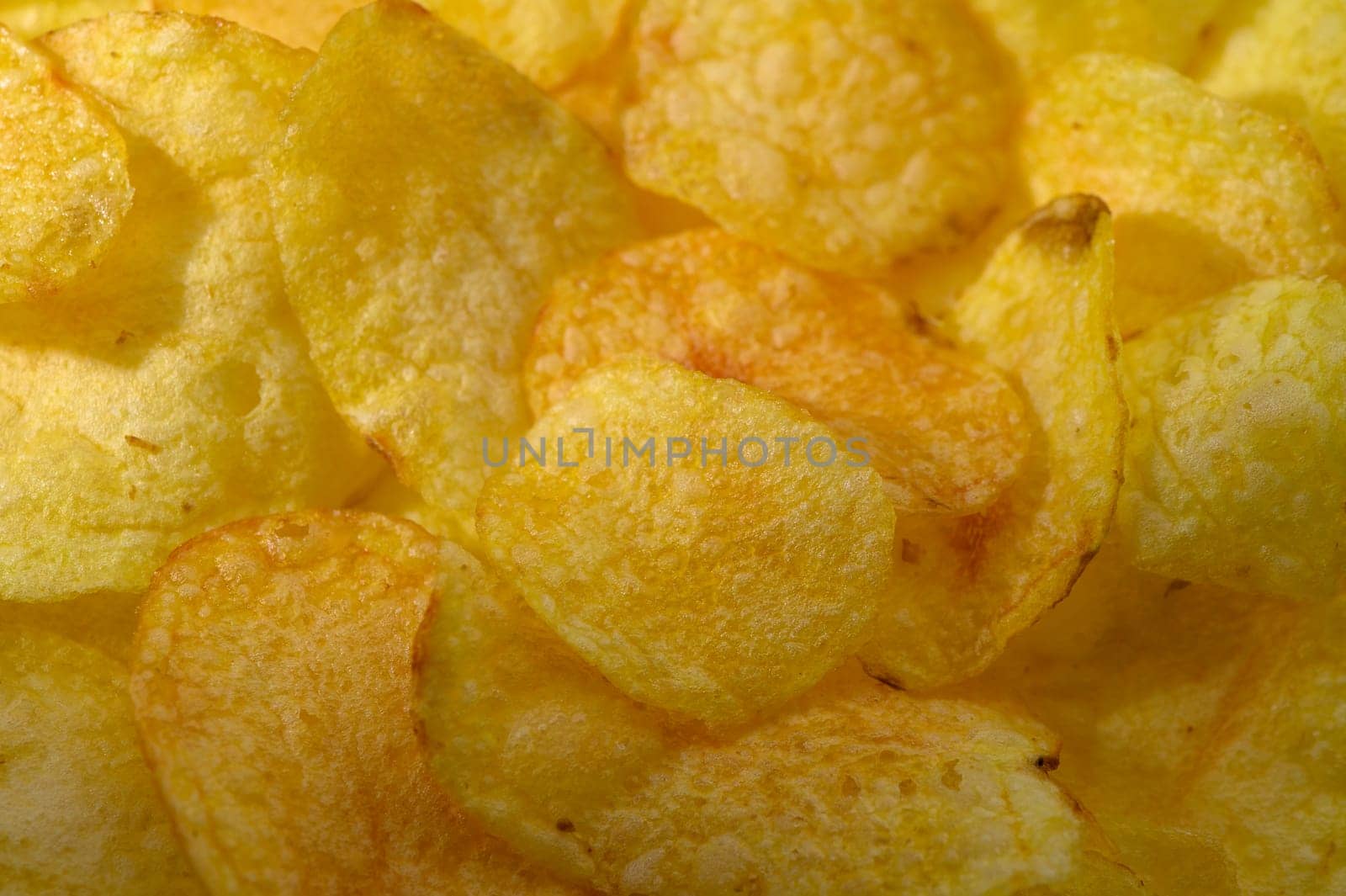 Lightly salted potato chips create a crunchy, inviting display for snack lovers at any gathering or party.