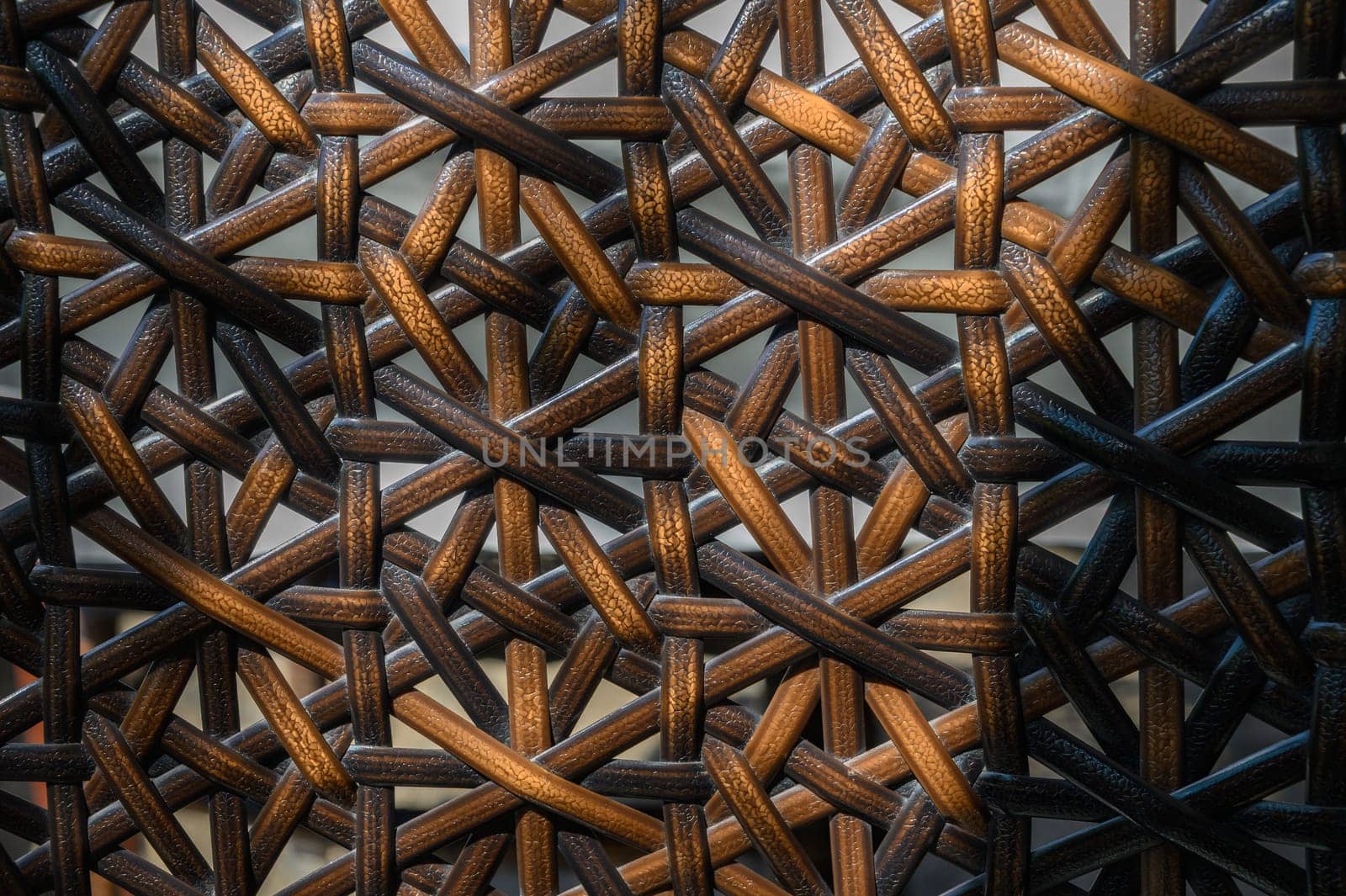 Stunning details of a handcrafted weaving display an artful blend of warm browns and blacks in the composition.
