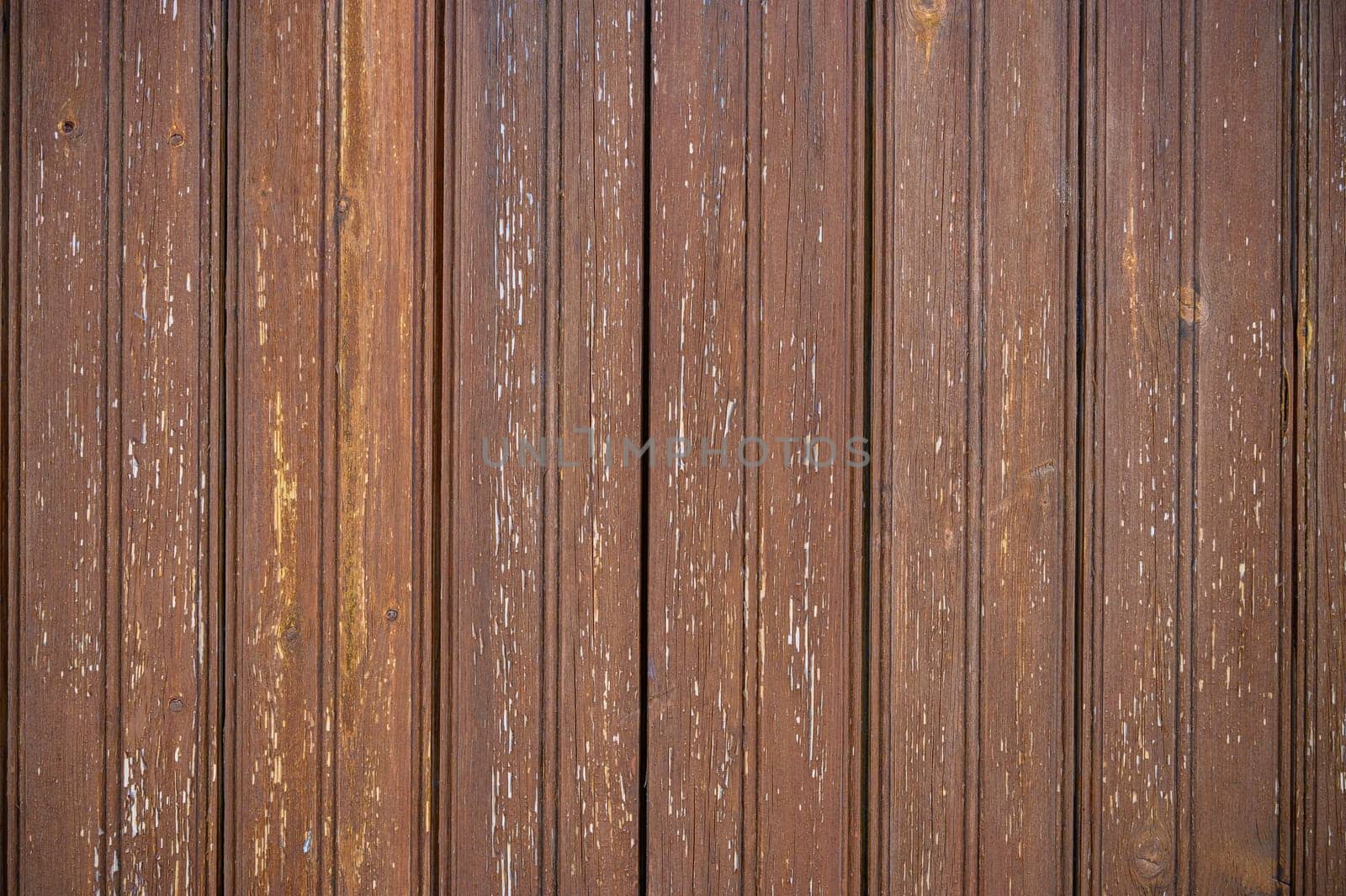 Rich brown tones and textured surfaces of vertical wooden planks evoke a sense of warmth and natural beauty.