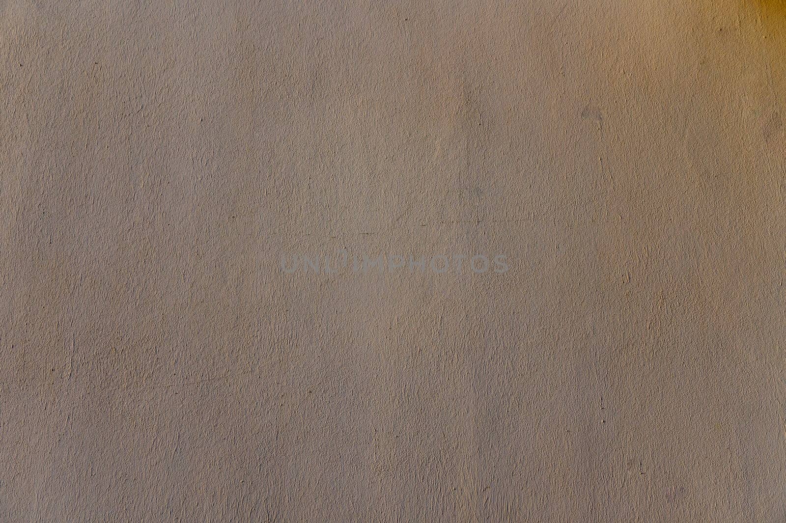 Soft fabric gently illuminated reveals a rich texture with captivating variations enhancing visual warmth and comfort.