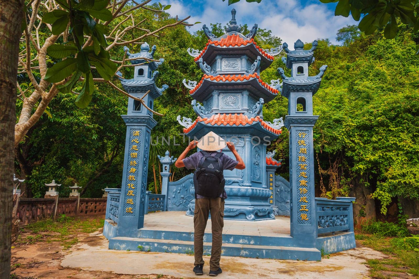 male tourist traveler at the temple on Buddhist pagoda in Da Nang, Vietnam. Travel and tourism in Asia