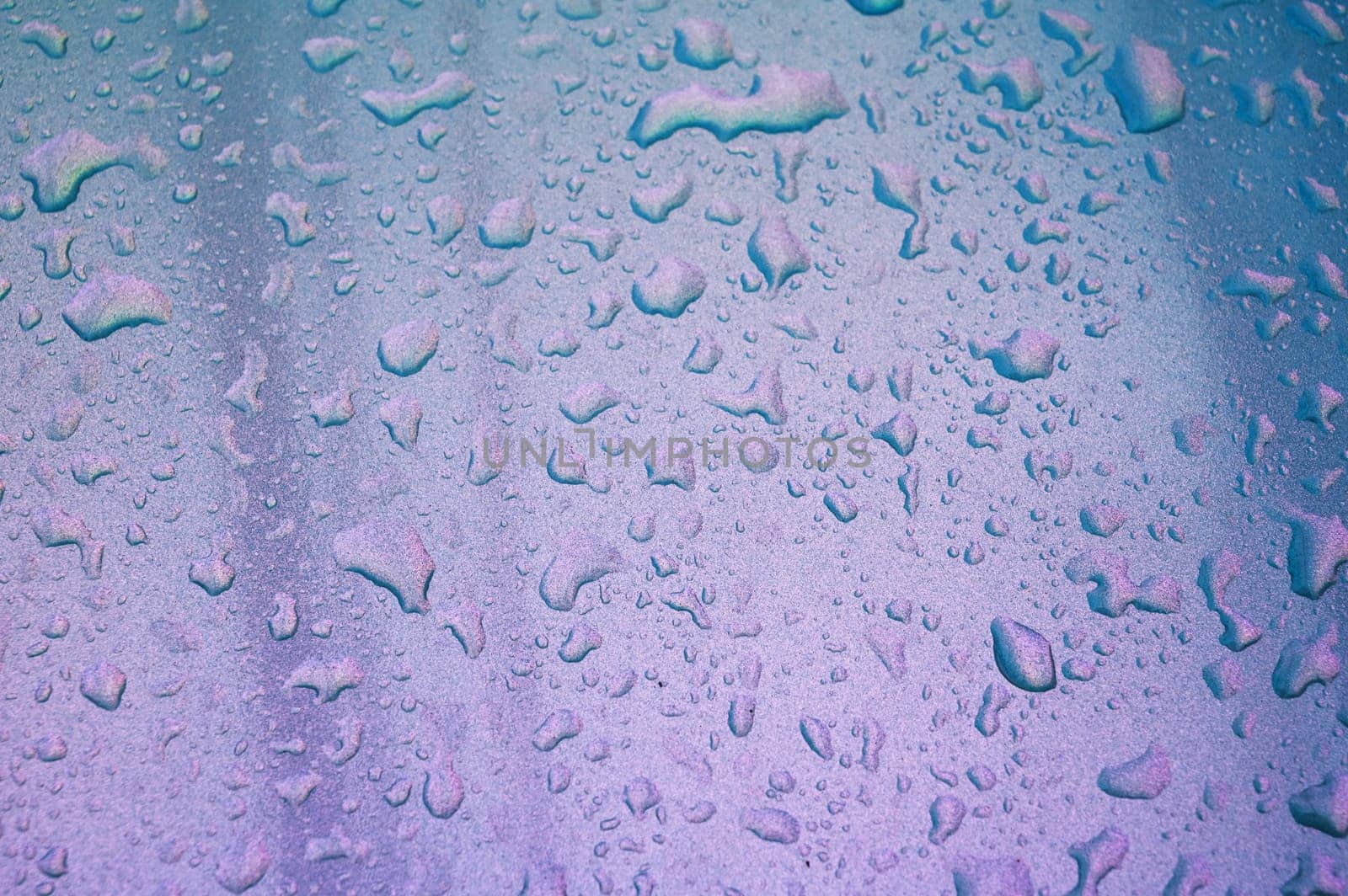 abstract pearl background with texture of rain drops on a metal surface close-up