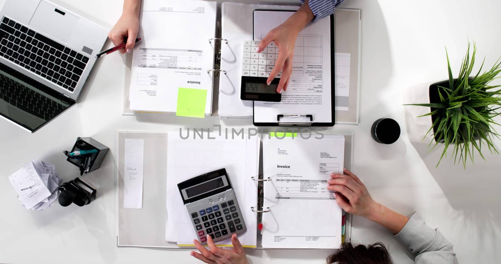 Top view of young woman accountant doing tax audit work