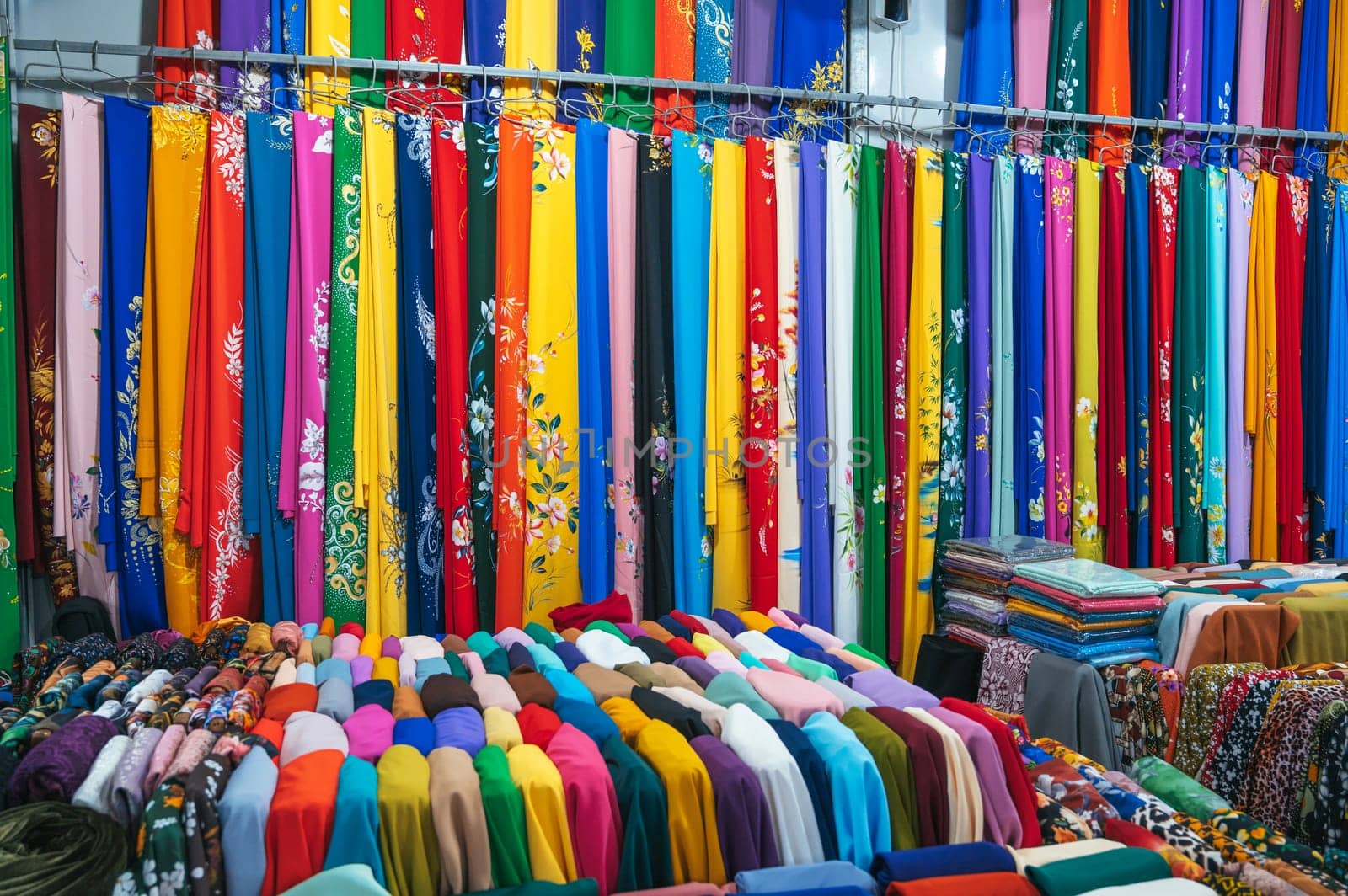 clothing and fabrics at the textile market bazaar in Asia in Vietnam