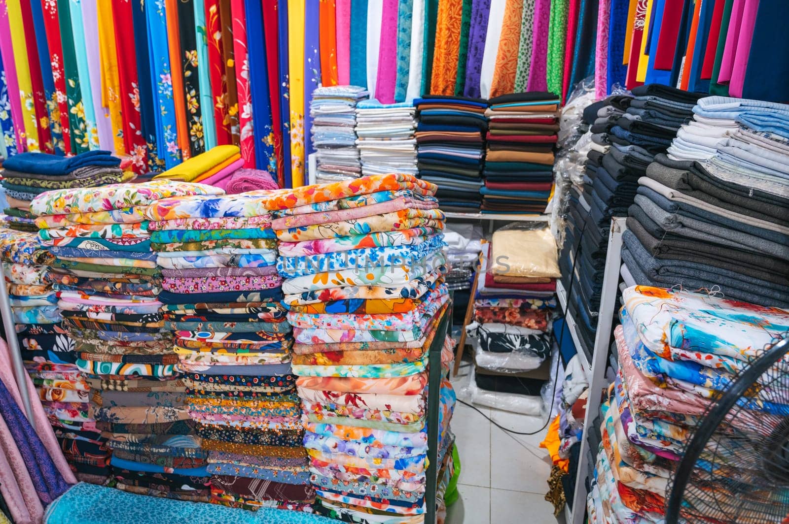 clothing and fabrics at textile market bazaar in Asia in Vietnam