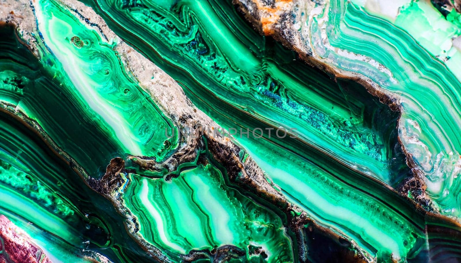 The green malachite. An ornamental stone. Photo texture. Macro.