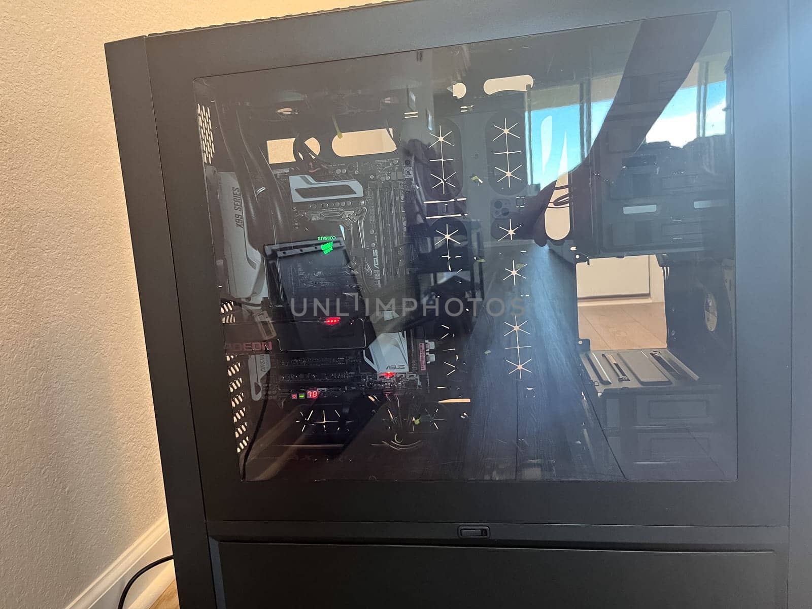 Castle Rock, Colorado, USA-August 18, 2024-A custom built gaming PC with an open side panel revealing internal components The build features a Radeon graphics card liquid cooling system multiple storage bays and a high performance power supply The black case has ample ventilation and cable management for optimal airflow Ideal for gaming enthusiasts and PC builders