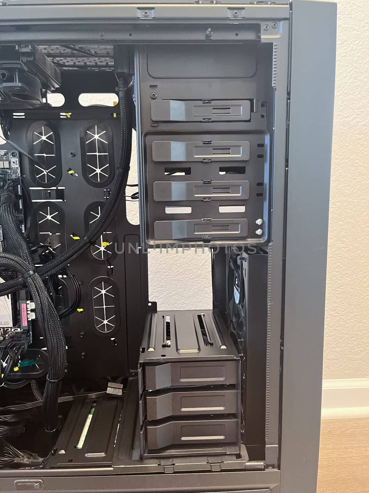 Castle Rock, Colorado, USA-August 18, 2024-A custom built gaming PC with an open side panel revealing internal components The build features a Radeon graphics card liquid cooling system multiple storage bays and a high performance power supply The black case has ample ventilation and cable management for optimal airflow Ideal for gaming enthusiasts and PC builders