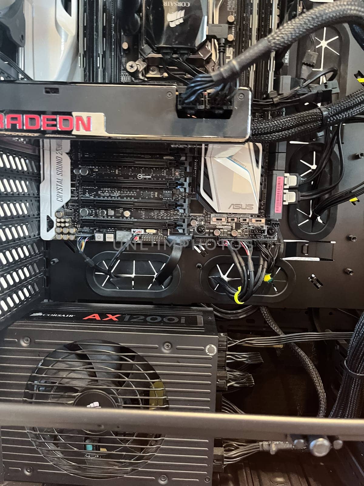 Castle Rock, Colorado, USA-August 18, 2024-A custom built gaming PC with an open side panel revealing internal components The build features a Radeon graphics card liquid cooling system multiple storage bays and a high performance power supply The black case has ample ventilation and cable management for optimal airflow Ideal for gaming enthusiasts and PC builders