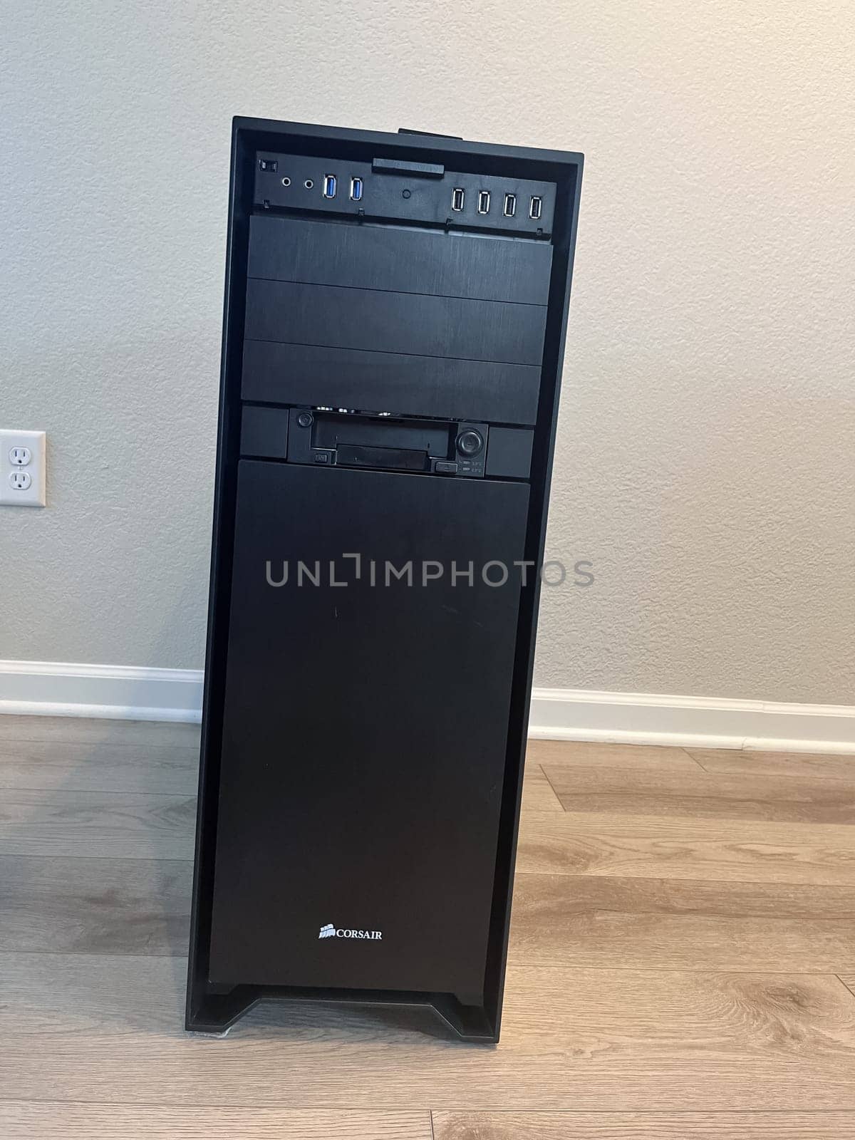 Castle Rock, Colorado, USA-August 18, 2024-A custom built gaming PC with an open side panel revealing internal components The build features a Radeon graphics card liquid cooling system multiple storage bays and a high performance power supply The black case has ample ventilation and cable management for optimal airflow Ideal for gaming enthusiasts and PC builders
