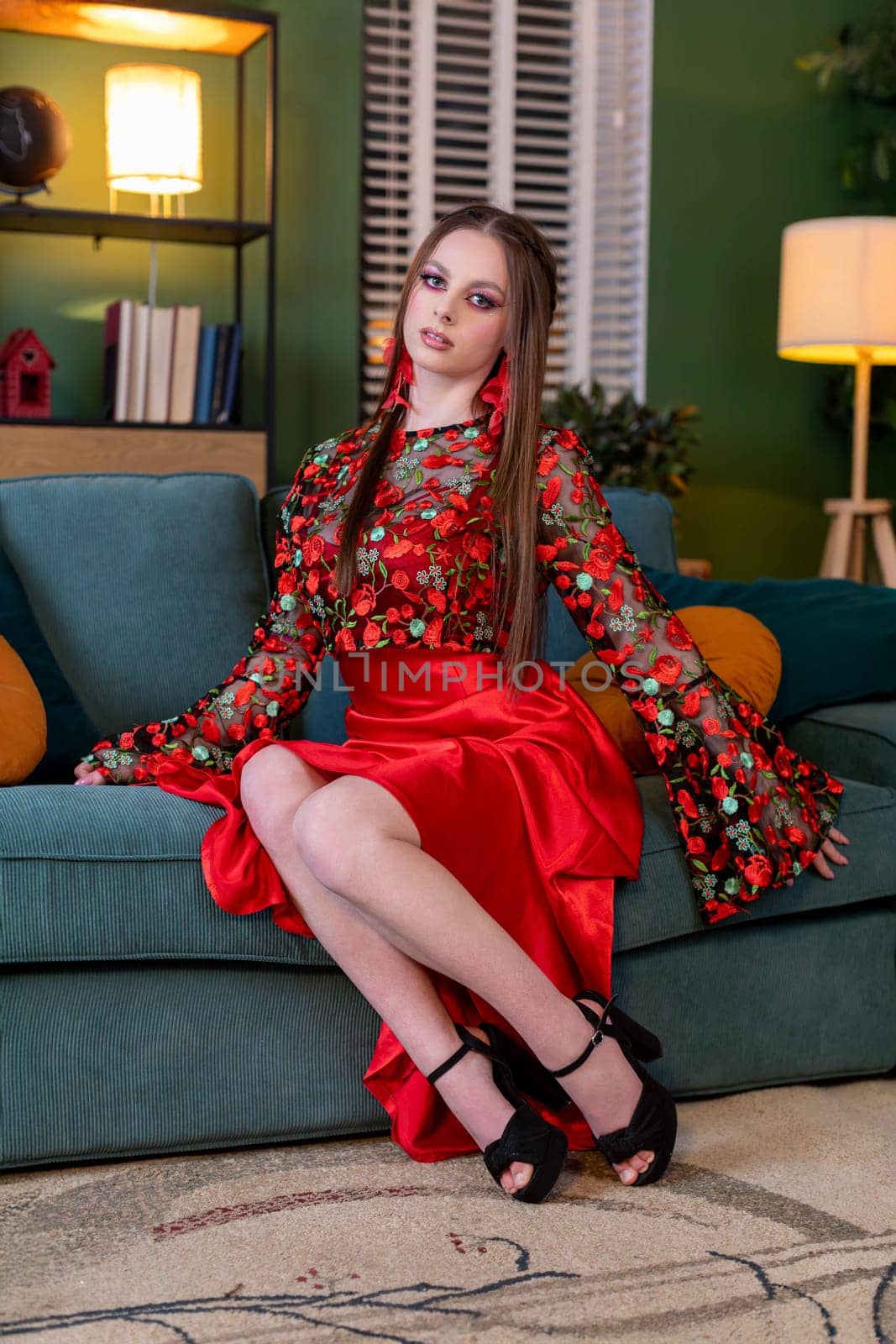 A stylish young woman poses confidently in a vibrant and colorful setting, showcasing the latest modern fashion trends