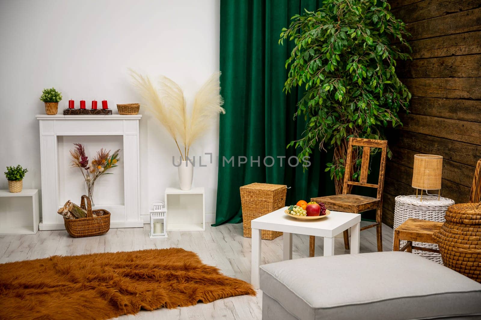 A stylish living room with wicker furniture and vibrant greenery, creating a warm and cozy atmosphere