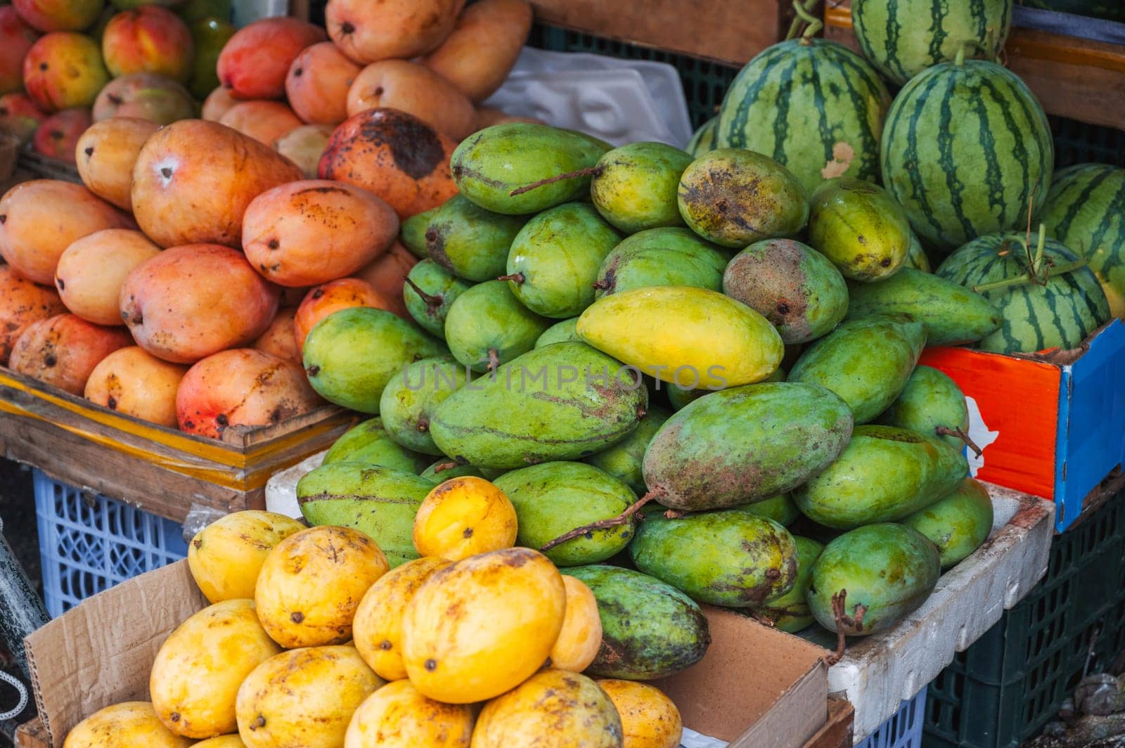 ripe various mango varieties on the Asian food market in Asia in Vietnam
