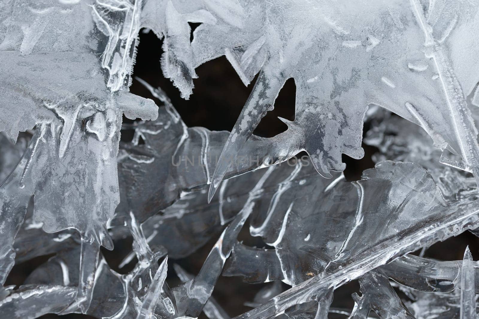 Frozen stream and ice closeup photo. Beautiful winter abstract background in nature. Concept for water and winter time