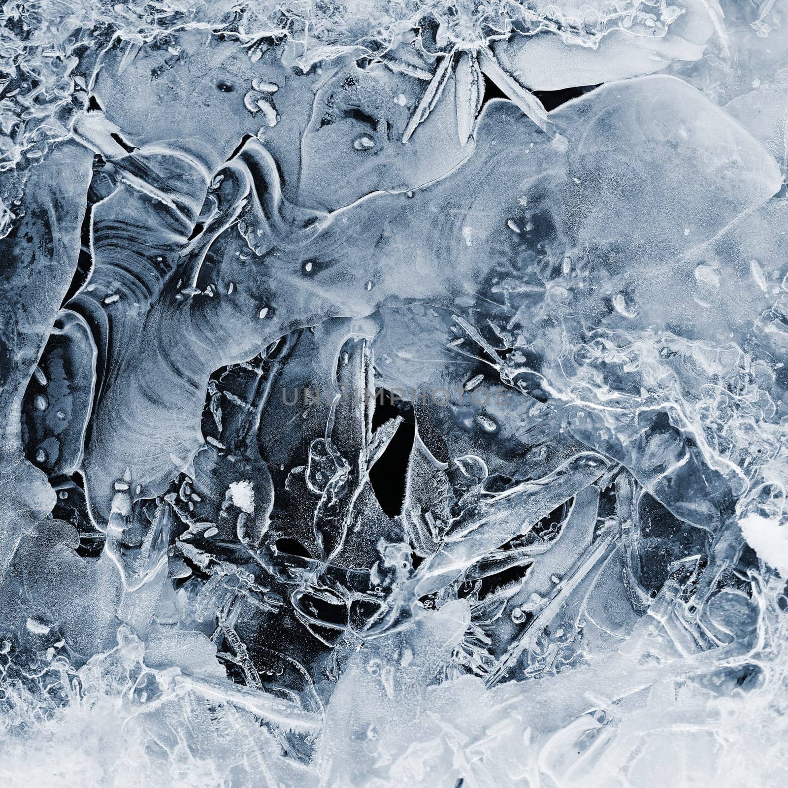 Frozen stream and ice closeup photo. Beautiful winter abstract background in nature. Concept for water and winter time