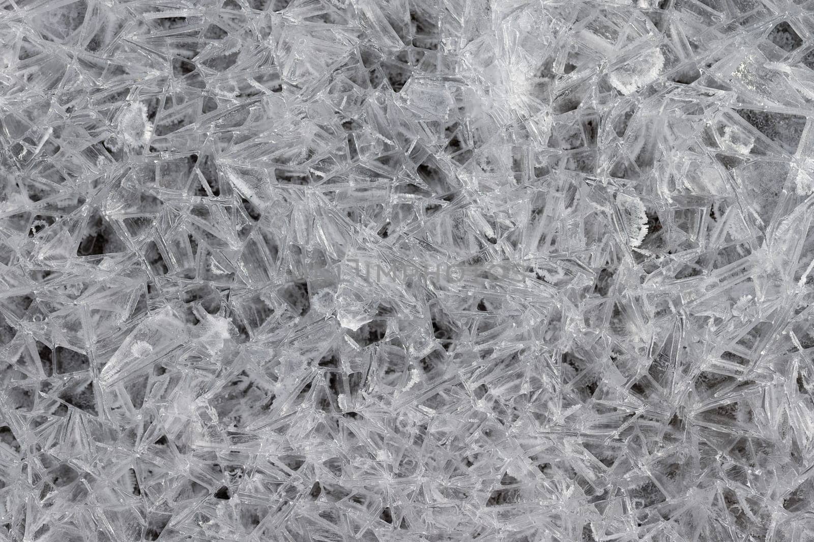 Frozen stream and ice closeup photo. Beautiful winter abstract background in nature. Concept for water and winter time