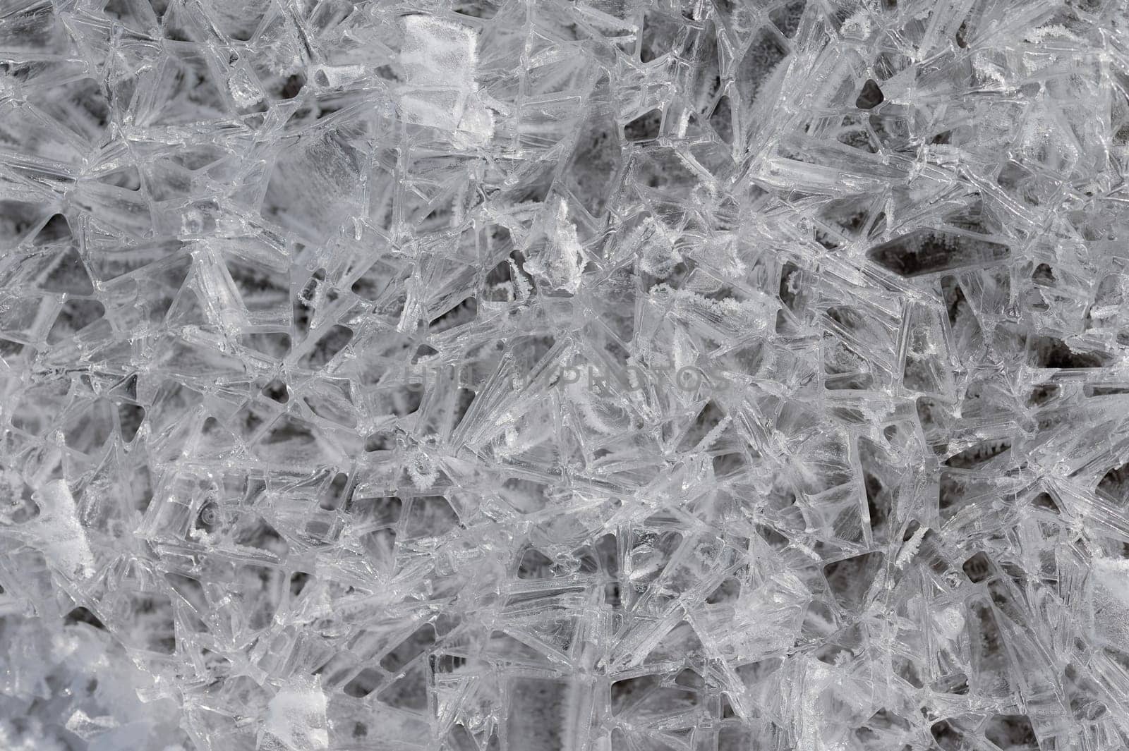 Frozen stream and ice closeup photo. Beautiful winter abstract background in nature. Concept for water and winter time