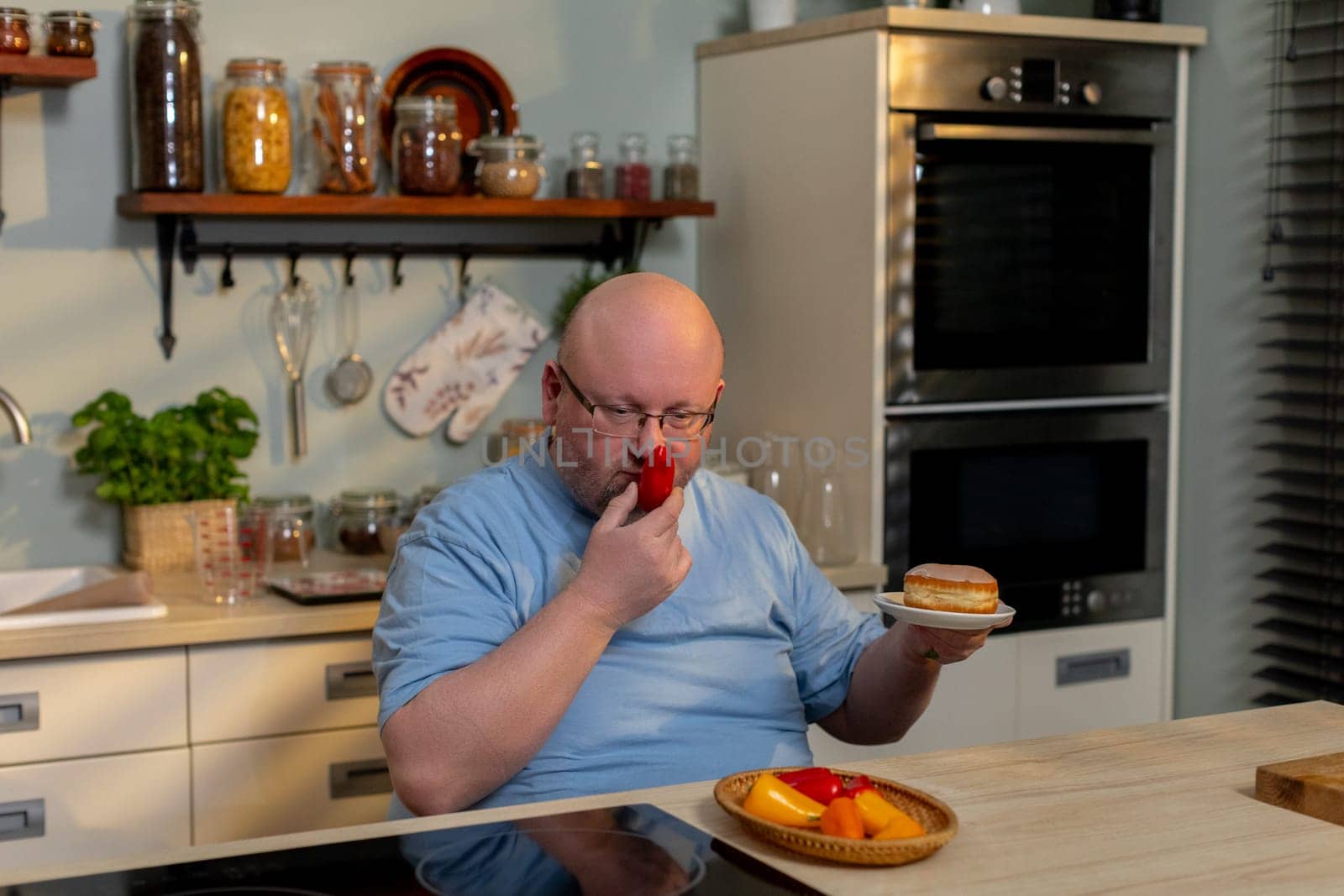 A man thoroughly enjoying fresh produce in a beautifully stylish kitchen, capturing the true essence of home cooking