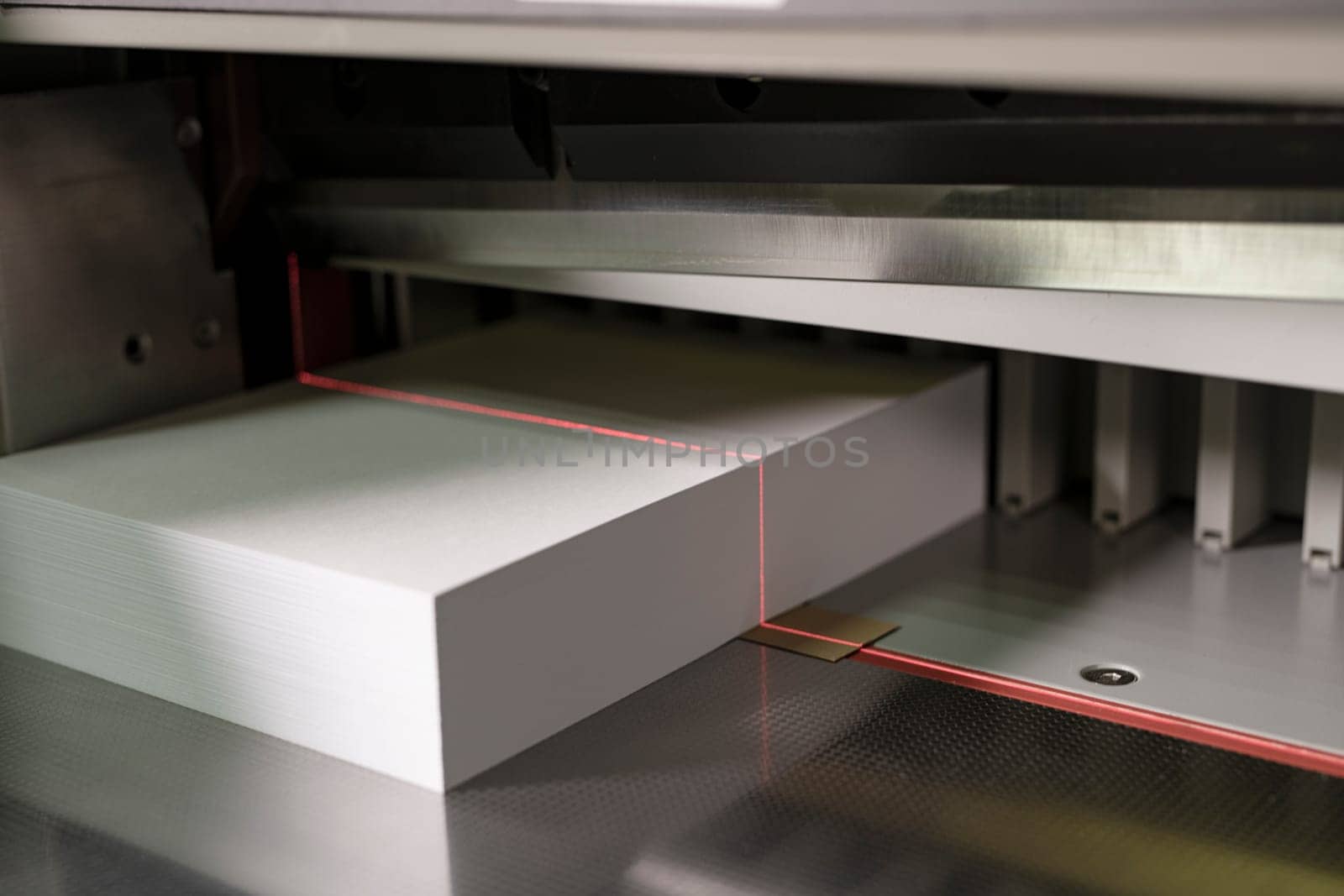 Contemporary cutting paper equipment for production notepads with laser line and metal details
