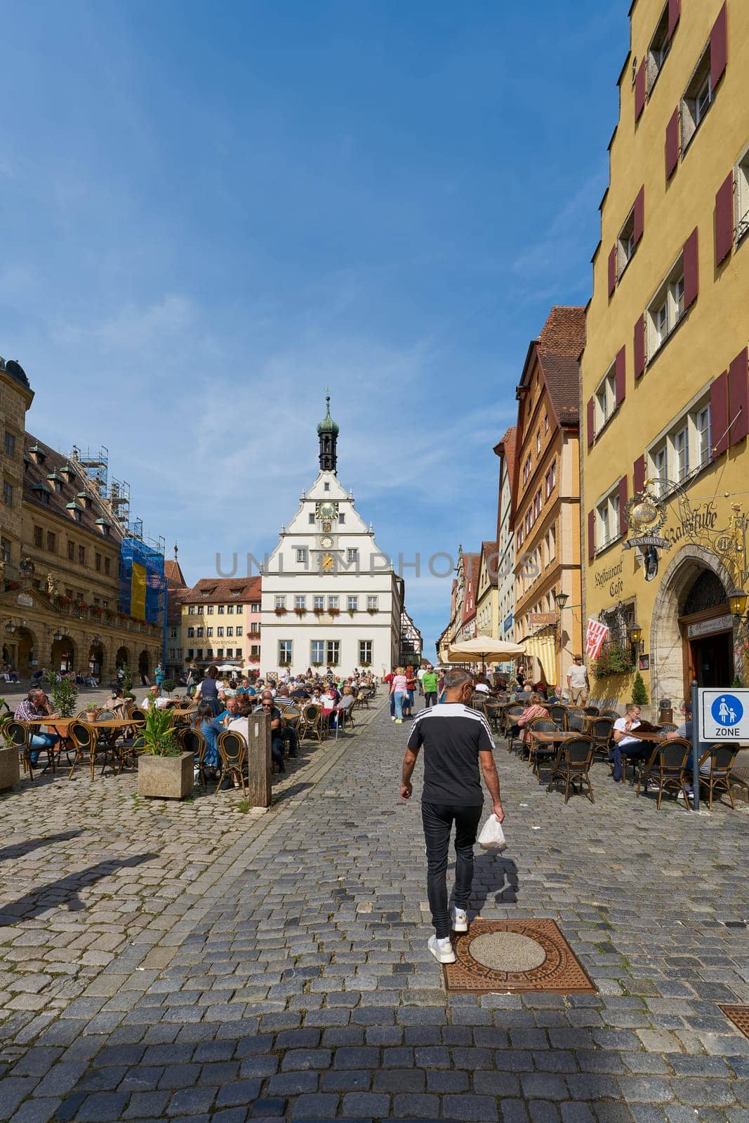 Rothenburg ob der Tauber, Germany – September 22, 2024: People on the market square in the old town of Rothenburg ob der Tauber in Germany