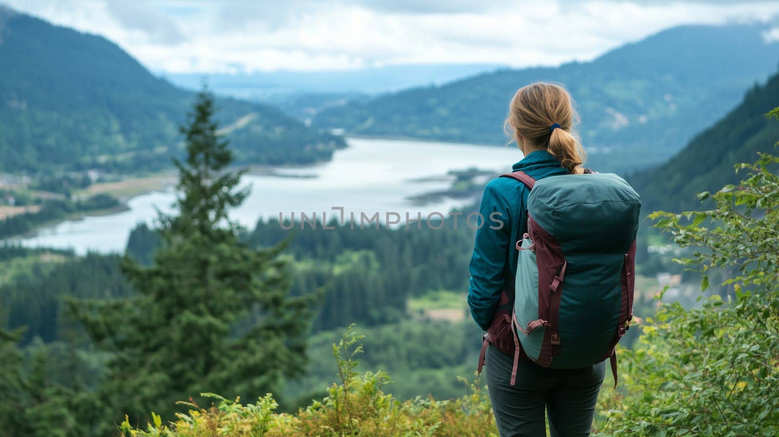 Travel, hiking, adventure, back view of inspired traveler hiker woman stands on top of mountain, green forest with river, looking at scenic view