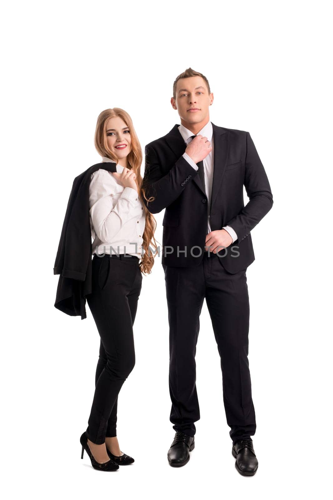 Side view of content young businessman and businesswoman in white shirts sitting back to back and looking at camera