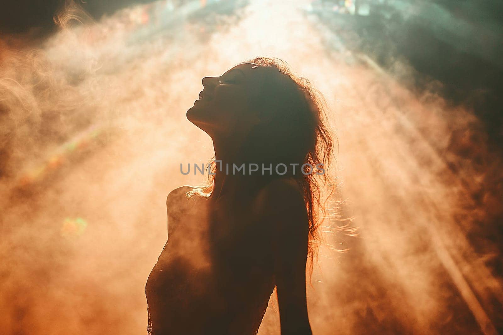 Silhouette of woman feeling joy in the clubs of light smoke