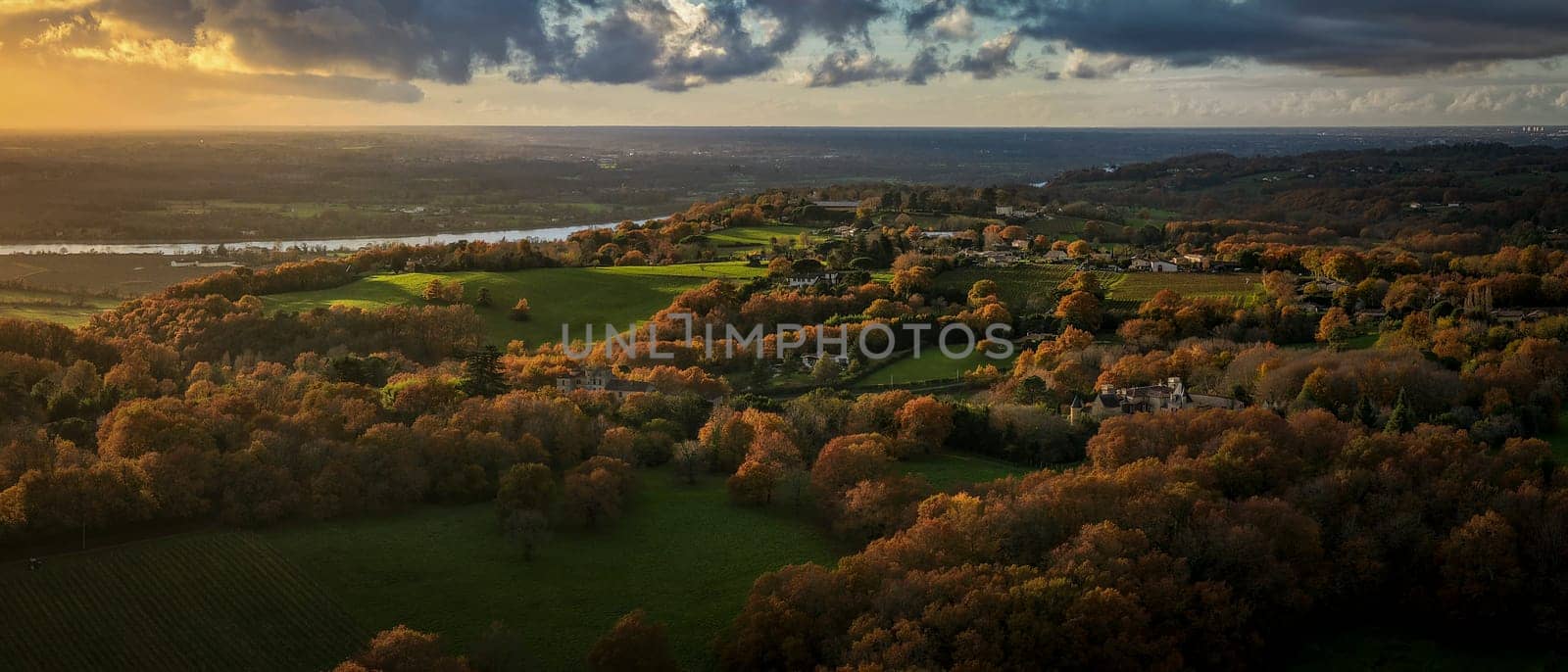 France, Gironde, Tabanac, Aerial view of the vineyard and wooded areas of Chateau le Pic in the Bordeaux vineyards at sunset. High quality photo