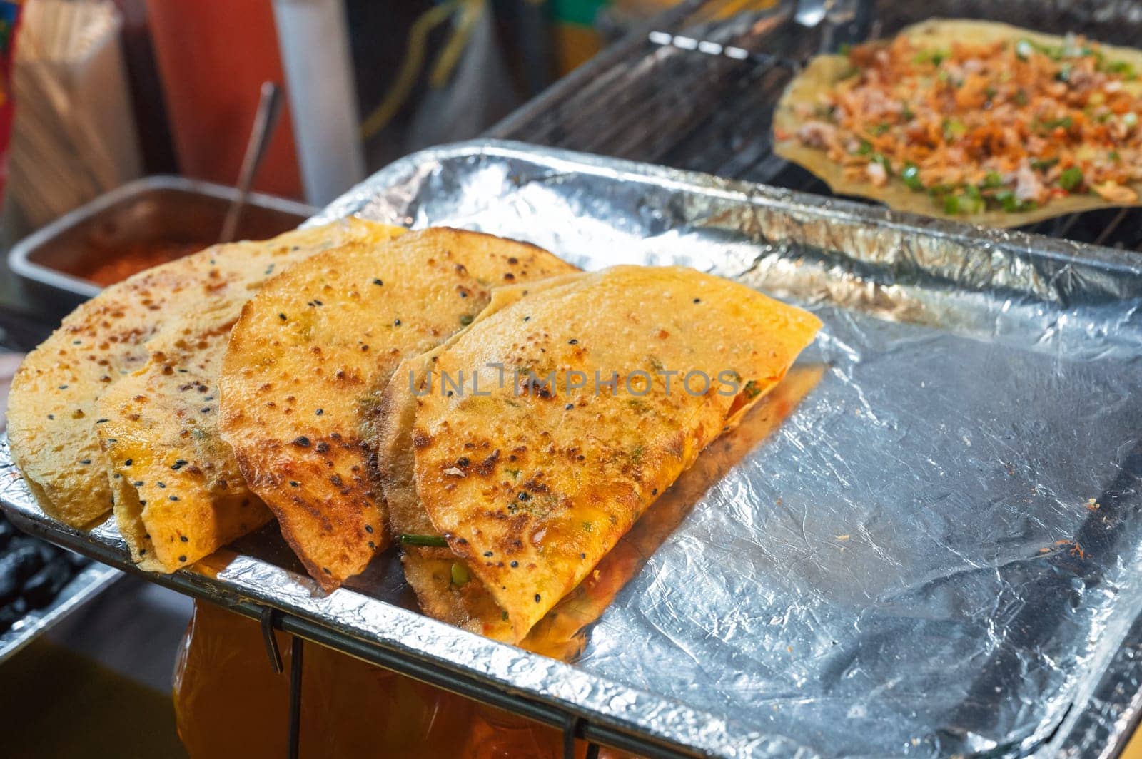 Vietnamese banh Xeo pancakes at an Asian street market in Vietnam. Traditional Vietnamese street food
