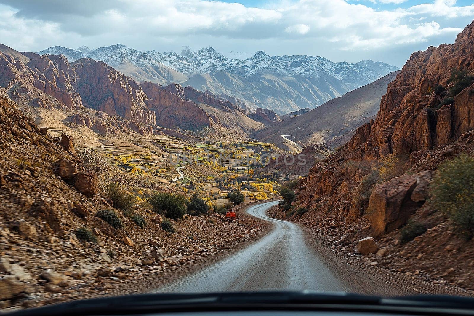 View from the car window onto a deserted mountain serpentine. Travel concept